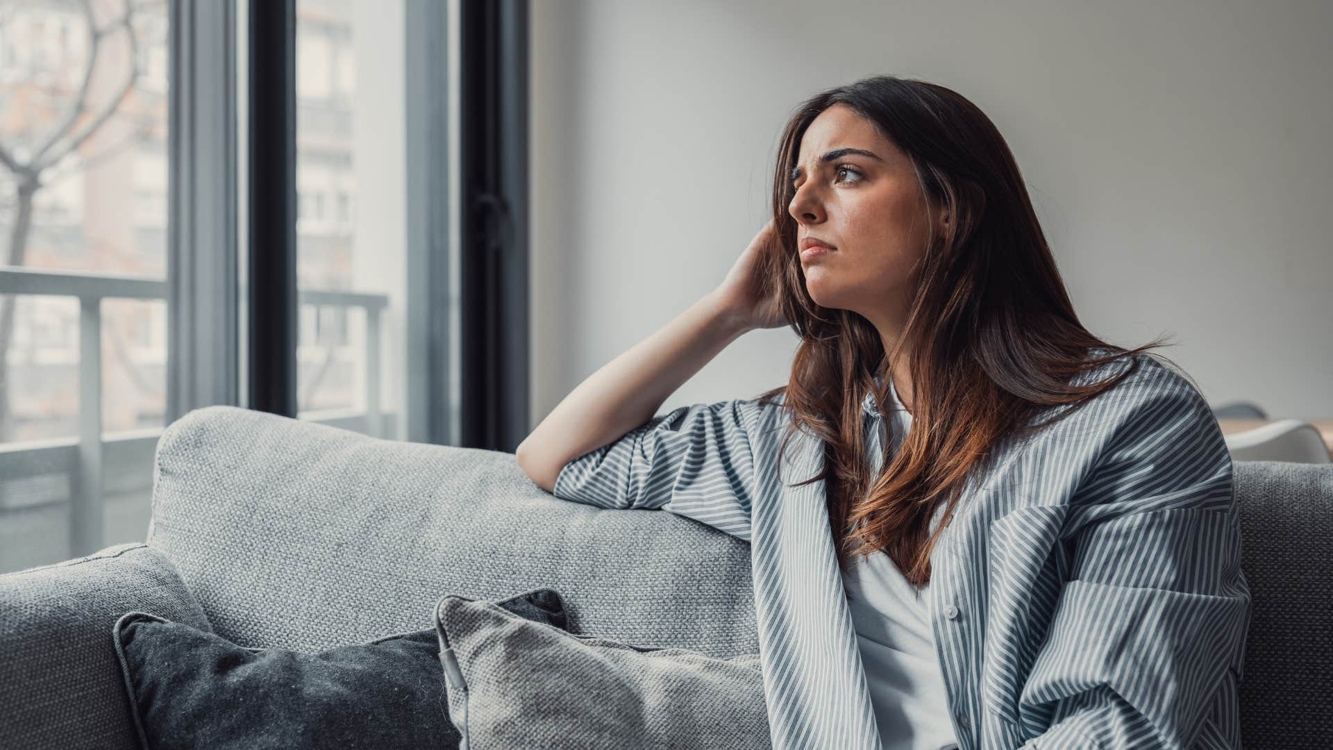 woman who is being tested by the universe as she feels under attack