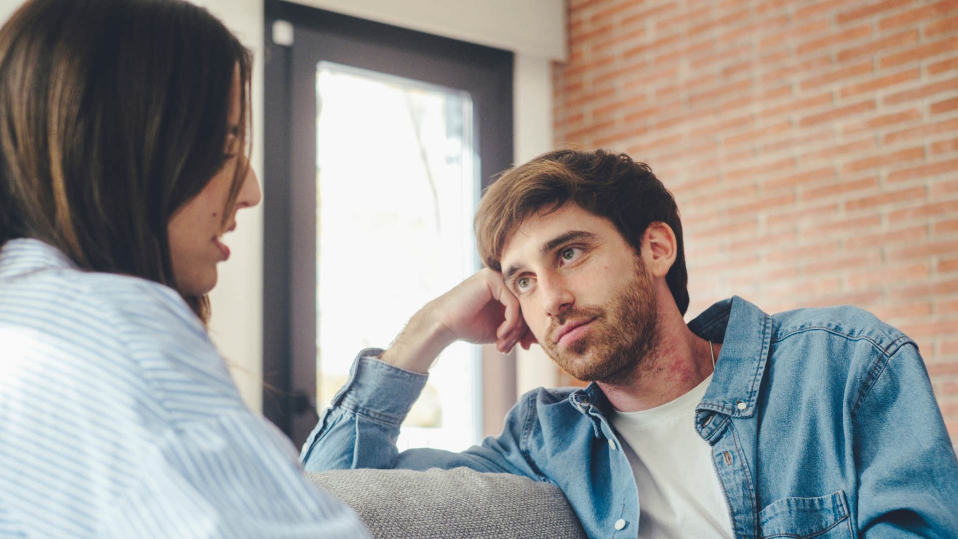 man in light blue jacket begins prioritizing her more as he listens to woman