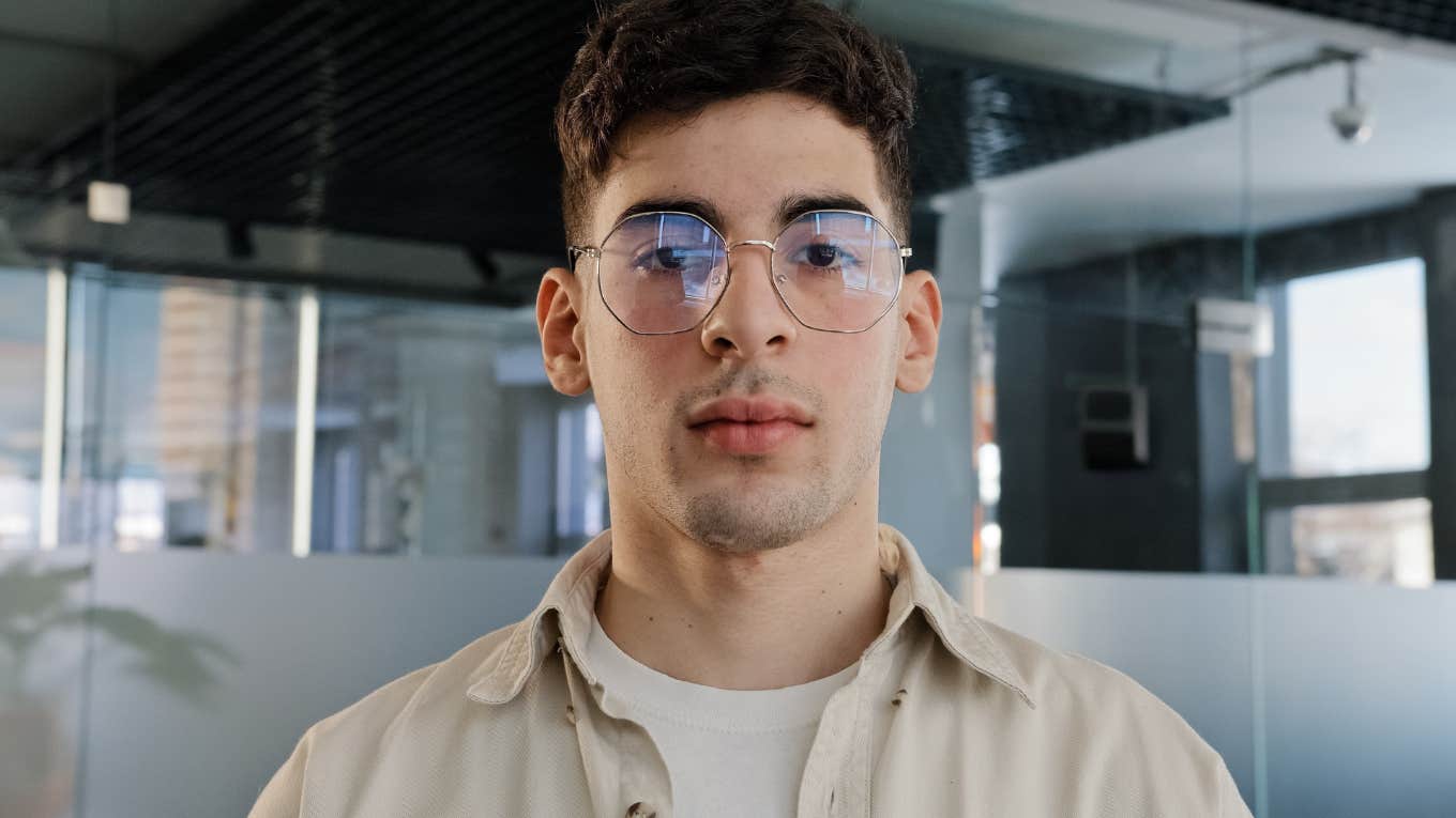 Men Who Are Afraid Of Falling In Love Often Do These Self-Sabotaging Things serious man afraid of falling in love looking upset