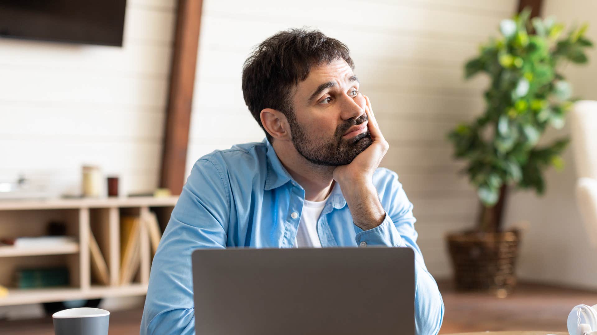 man daydreaming about escaping his life