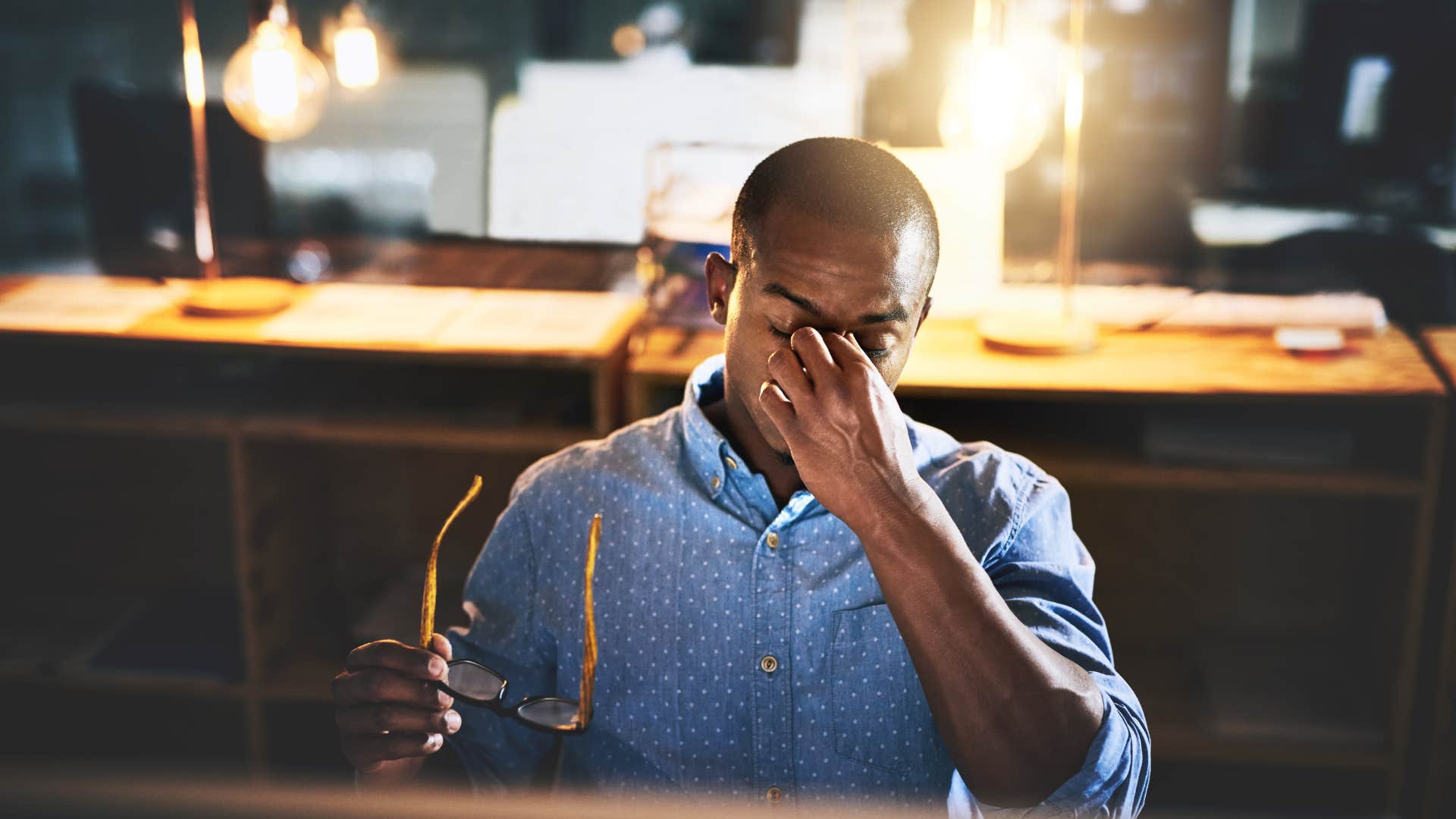 man overworking himself by staying busy