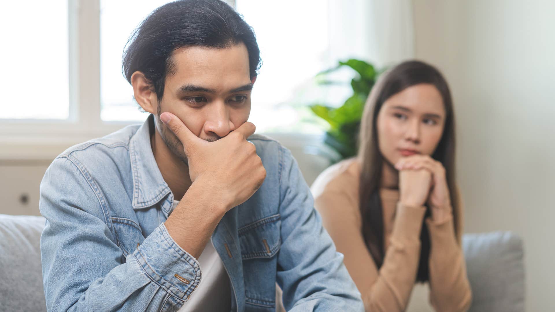 easily annoyed men who are quietly falling out of love with their wives usually do these things around the house Man who's easily annoyed sitting with his wife.