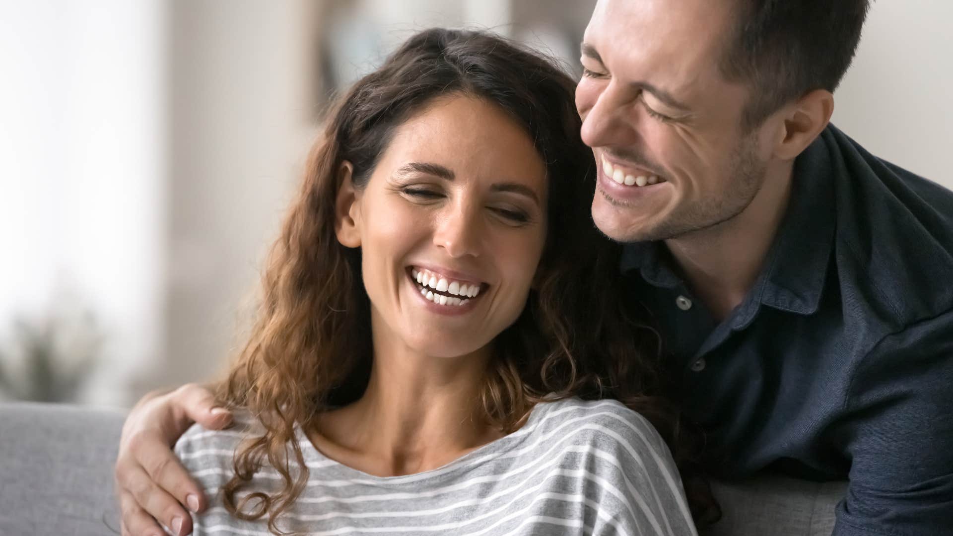 woman smiling with her husband who actively listens