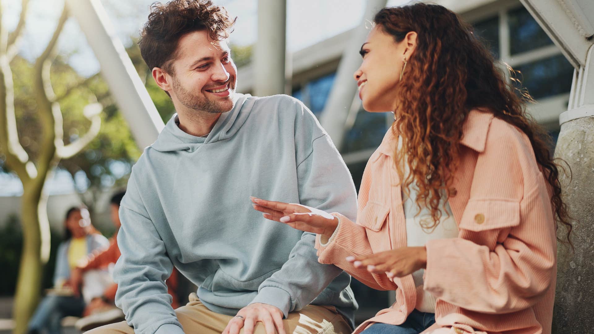 man offering compliments to his happy wife