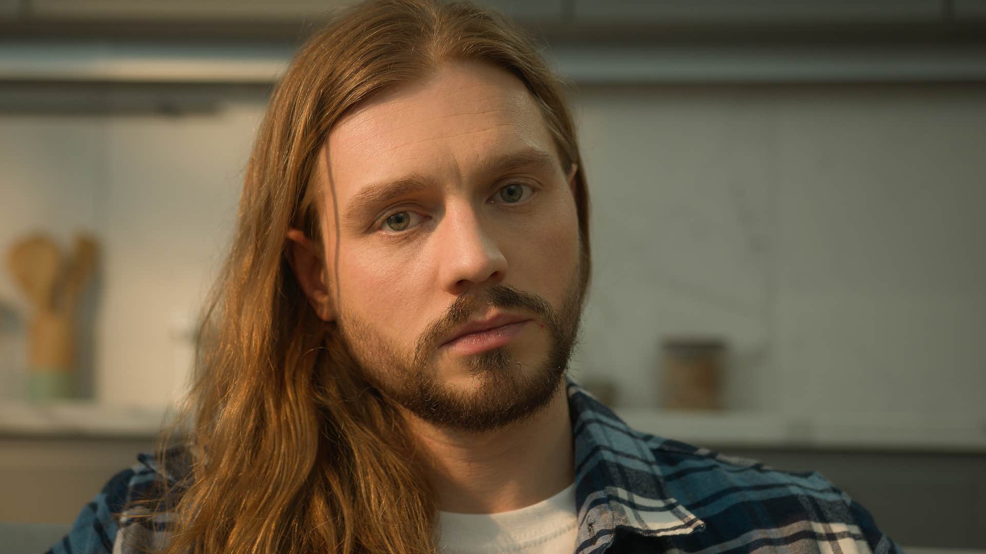 Man who fears needing people looking at the camera.