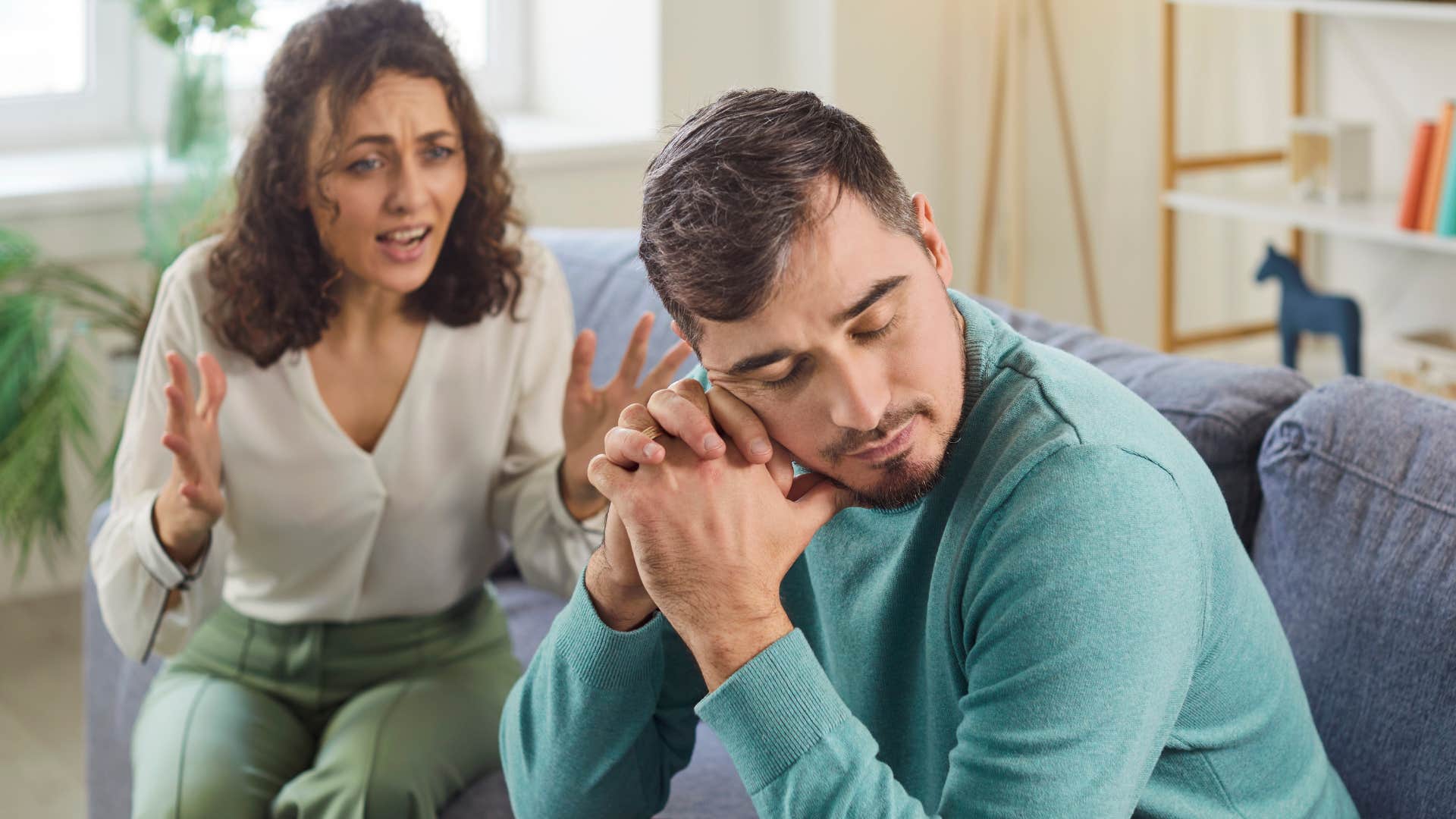 Man who gives the bare minimum sitting with his partner.