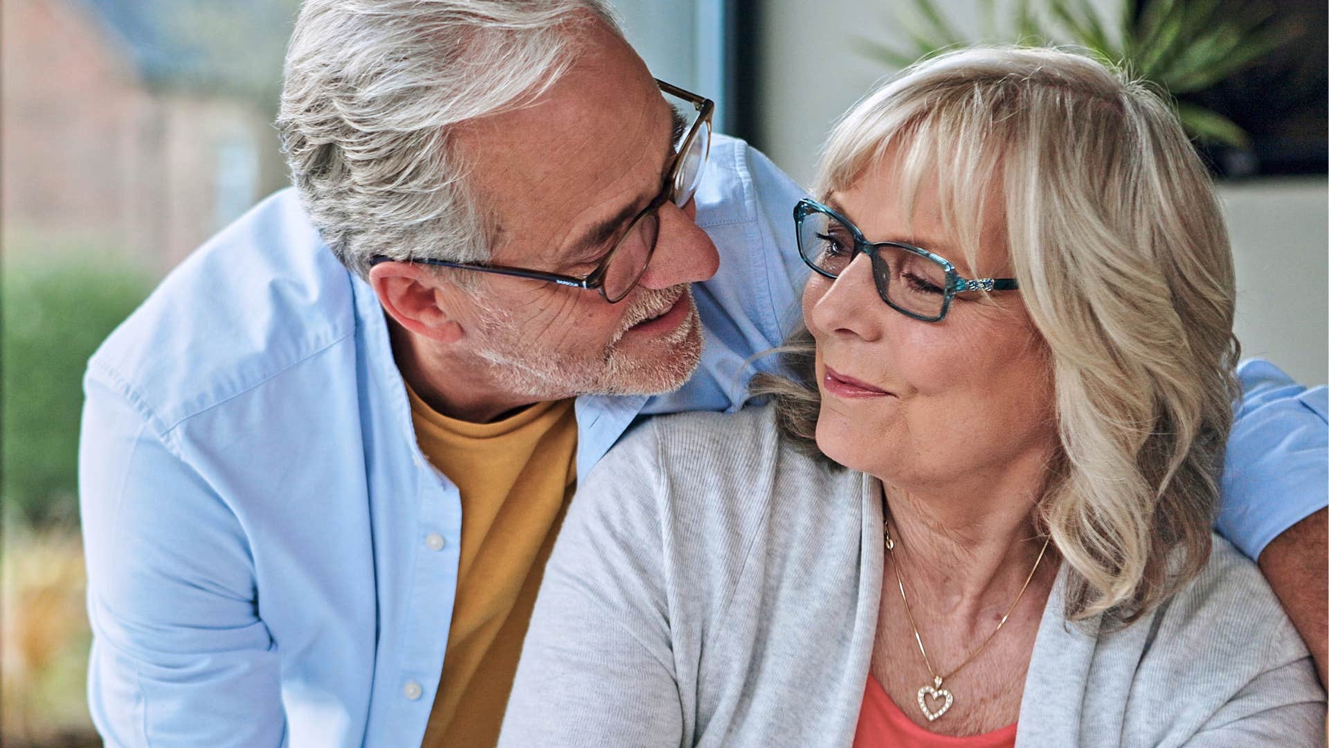 keep trying to impress her men who still adore their wives after years always do these ordinary things that mean everything woman looking at her husband who keeps trying to impress her