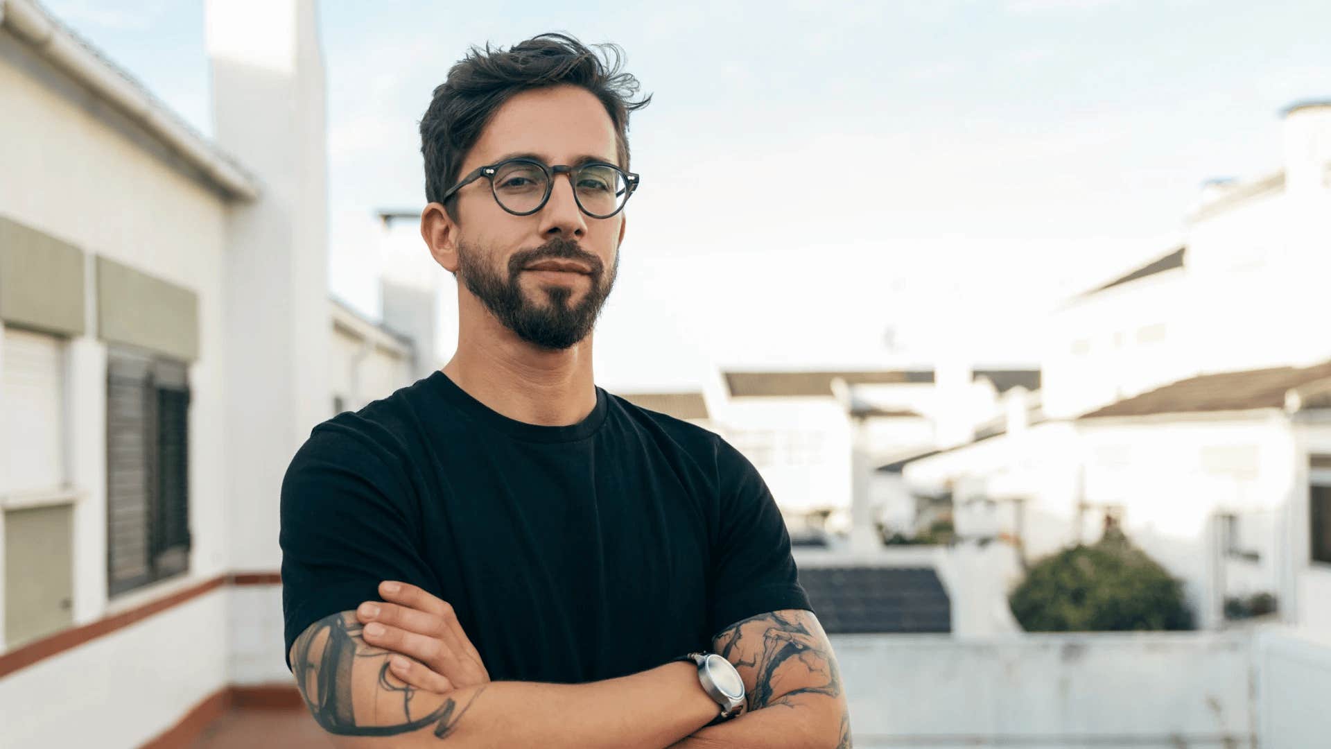 traits of a naturally intriguing person intriguing man standing confidently