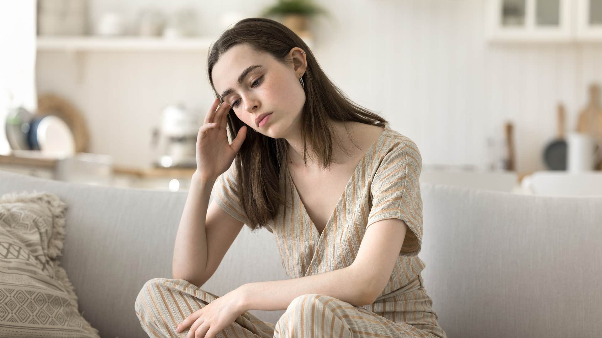 if you notice these things in someone's house they're likely in some sort of financial distress aura of tension or anxiety anxious woman sitting in her living room worrying