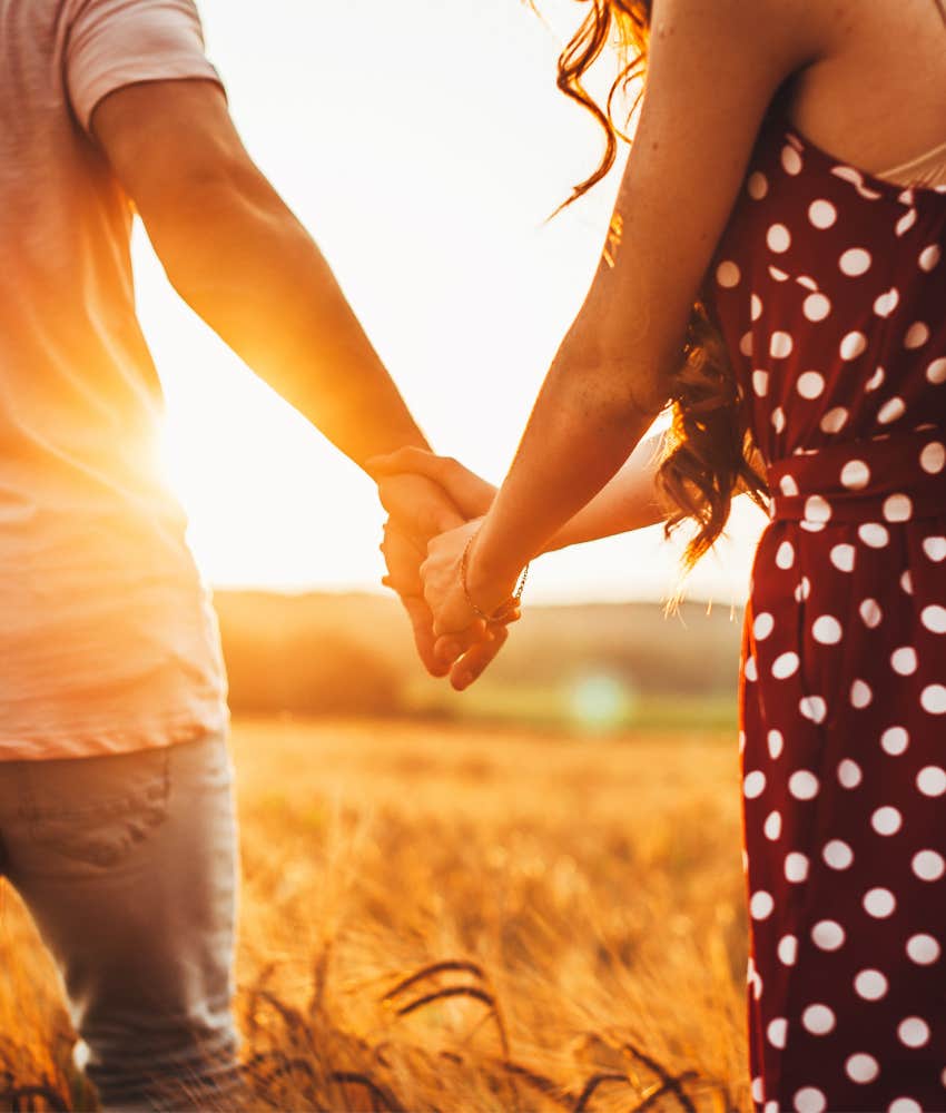 Couple hold hands as soulmates
