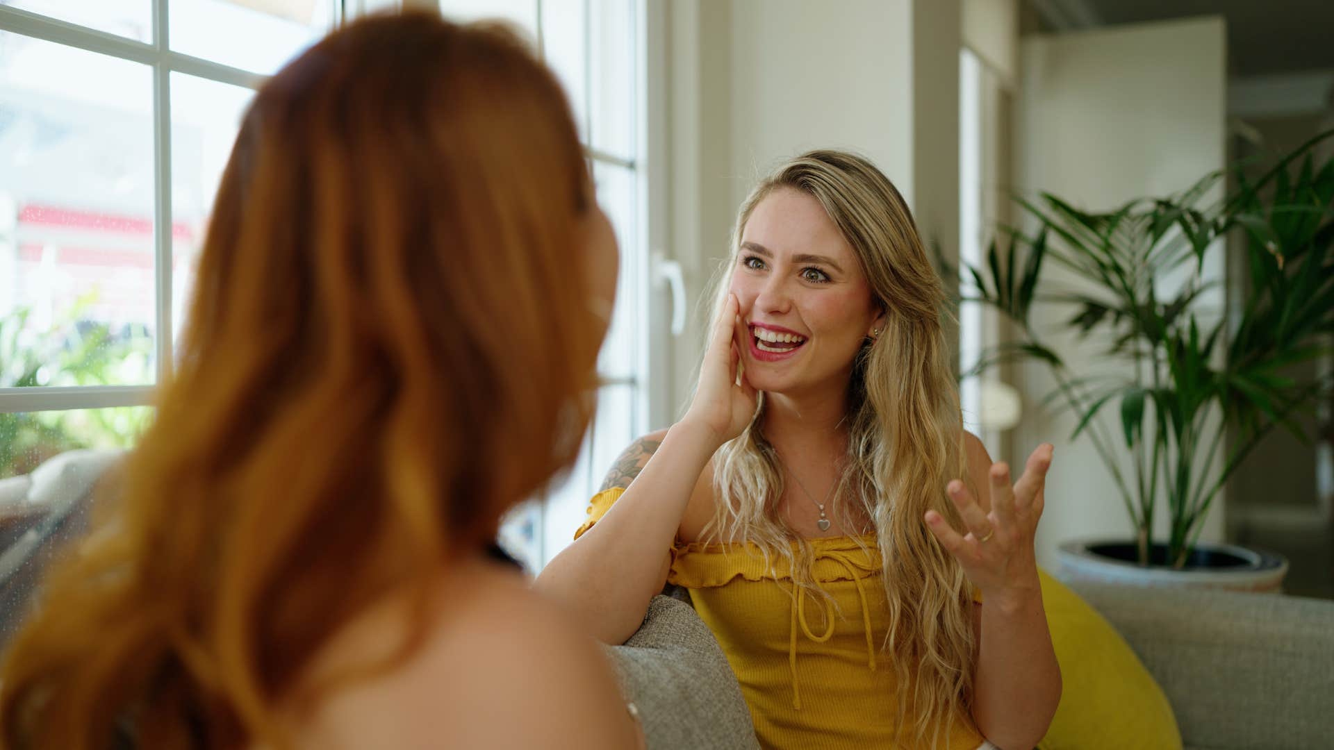 woman telling friend that's crazy during conversation