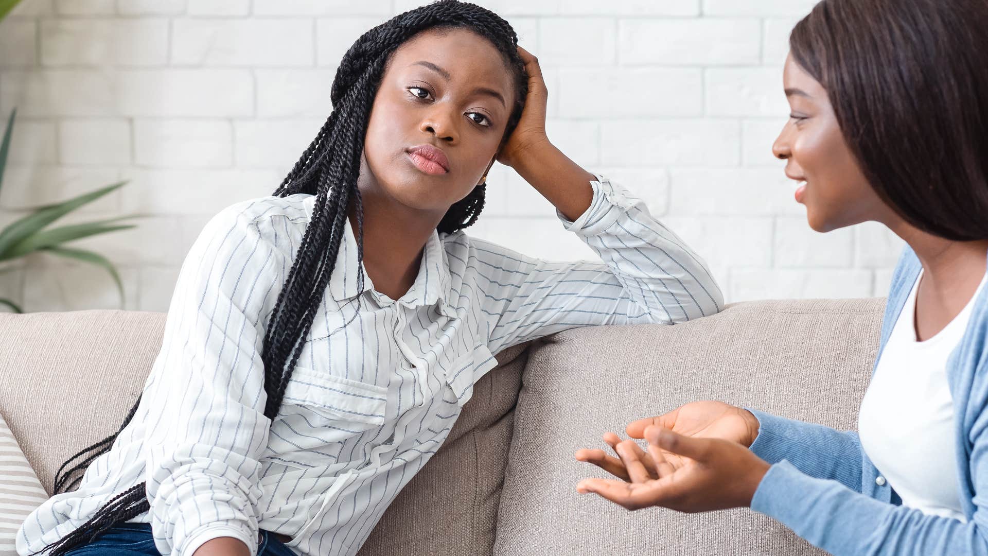 bored woman listening to friend talk