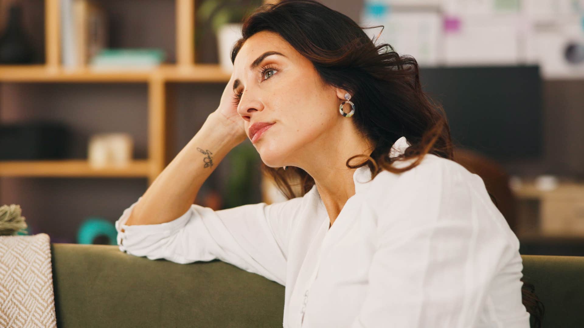 woman saying I'm fine on my own to herself at home