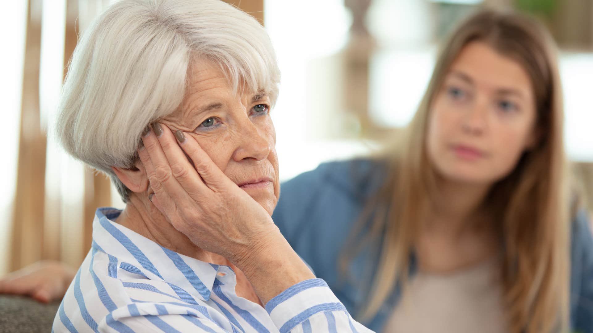 unhappy woman turned away from daughter after saying I've just been sleeping poorly