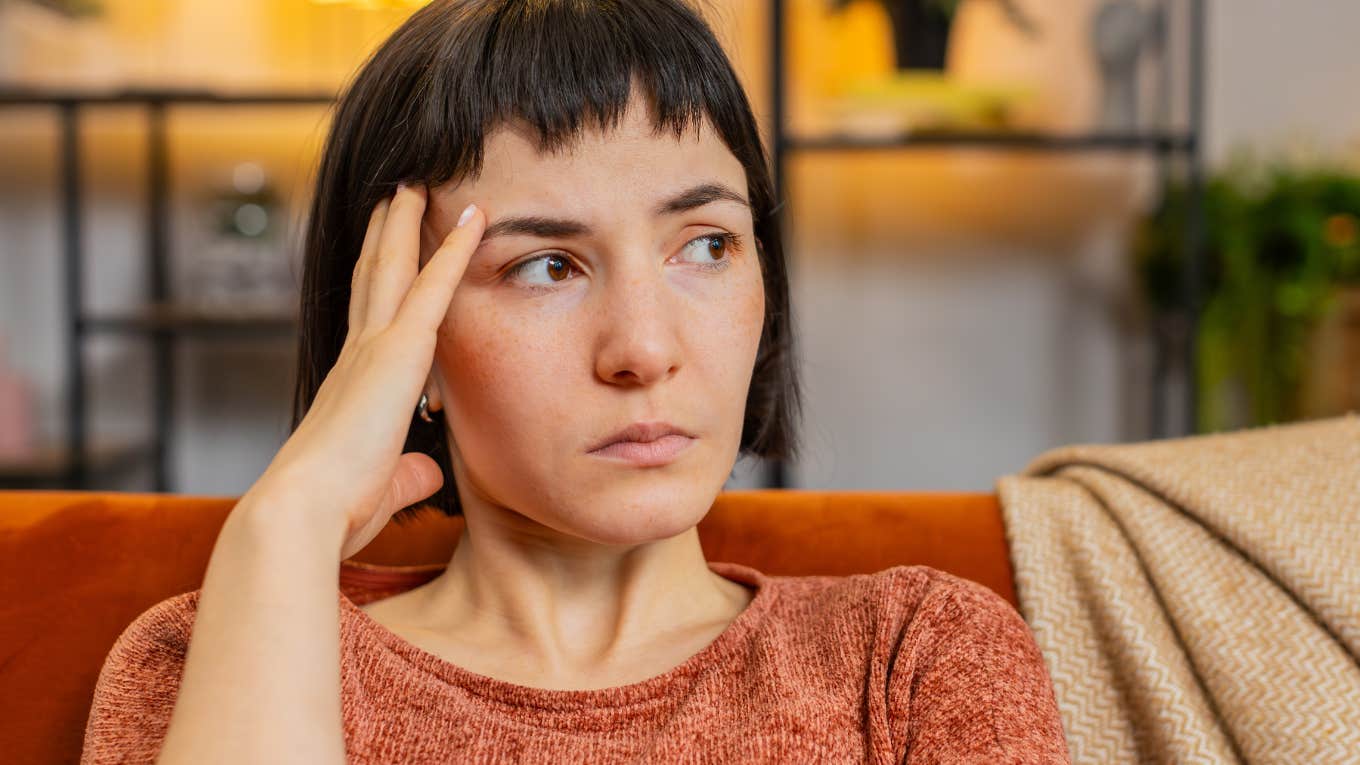 People Can Tell You're Unhappy In Life If You Say These Things Too Often sad woman unhappy with her life looking stressed out
