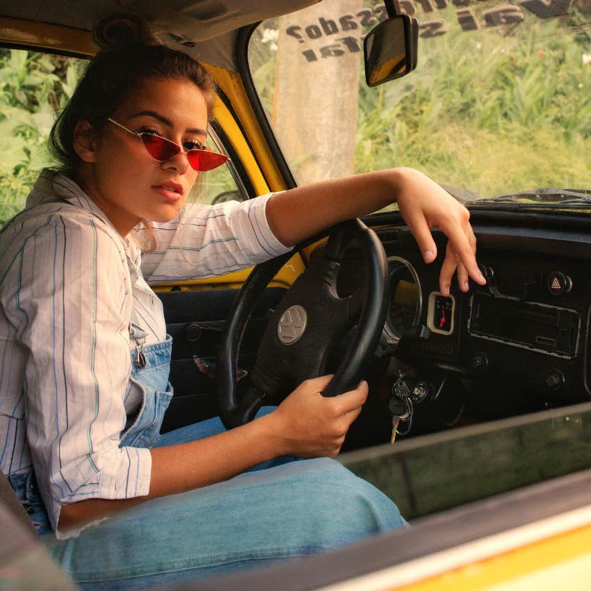 woman sitting in car family member reliability loyalty