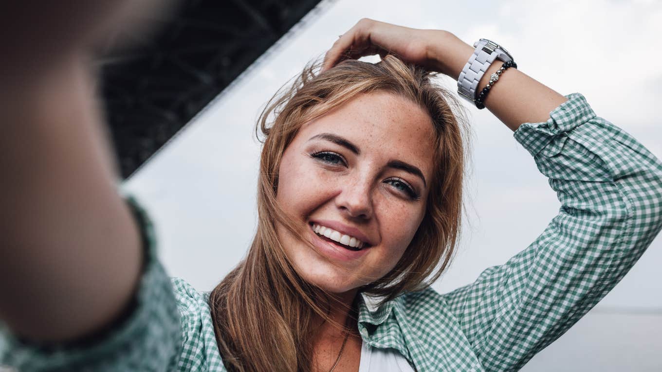 fearless woman smiling taking a selfie