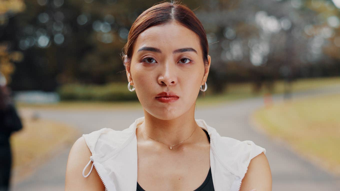 People Who Were Overweight As Kids Usually Struggle With These Habits As Adults stern woman standing outside to exercise