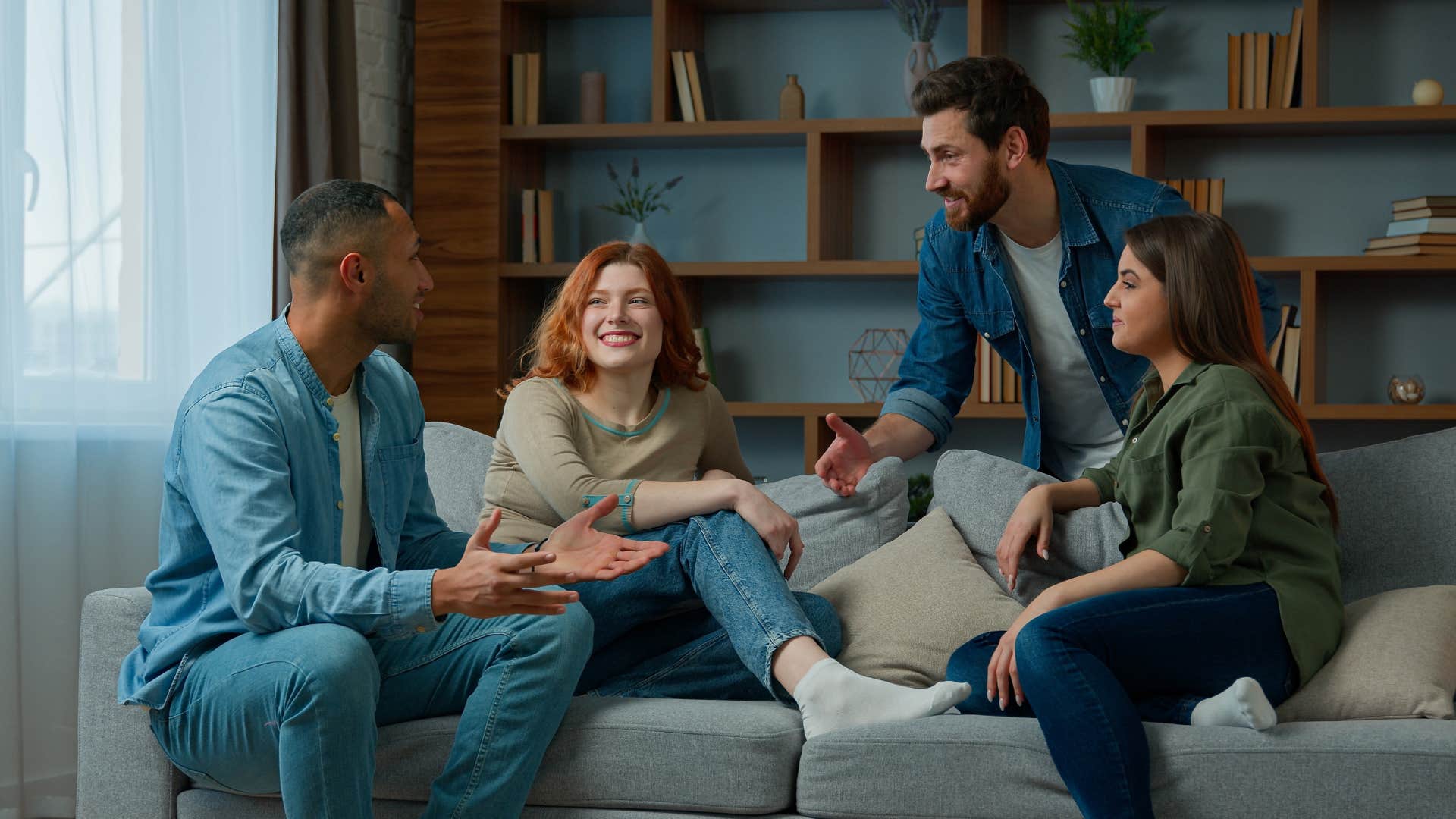 group of friends on couch coming up with creative curse words while laughing and smiling