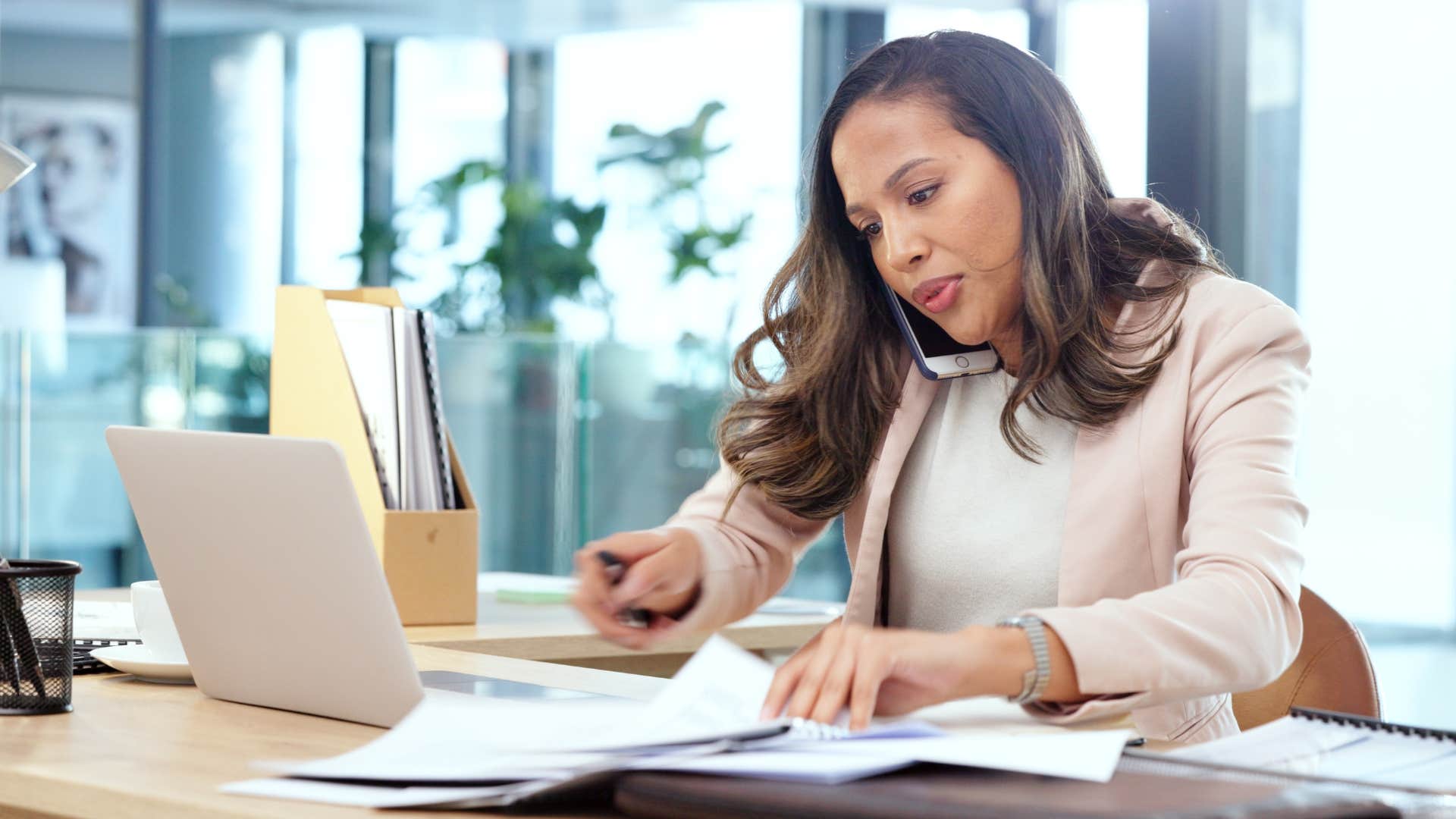 woman keeping desk messy as she works