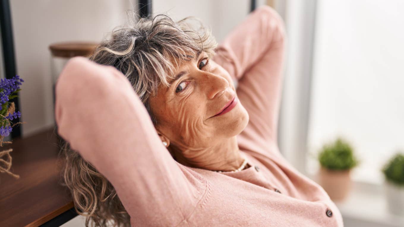 happy older woman enjoying solitude at home