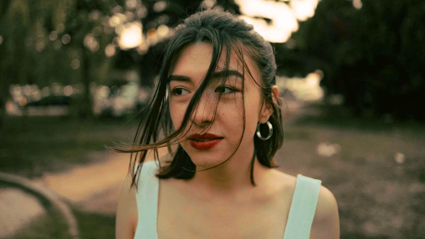 Pensive person looking down, illustrating the mental mistakes that keep people insecure and stuck in self-doubt for life