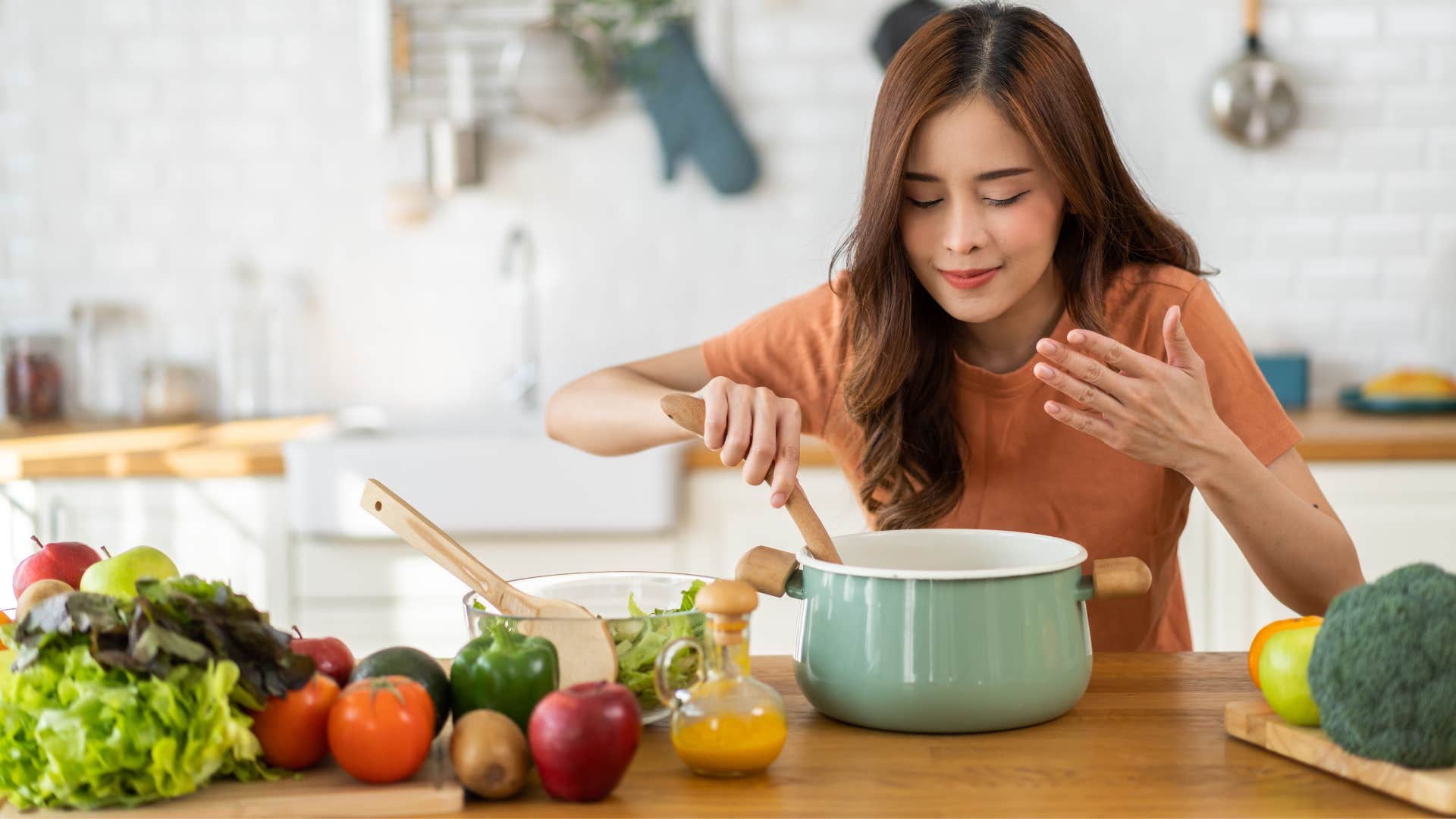 woman making a meal in high-quality cookware
