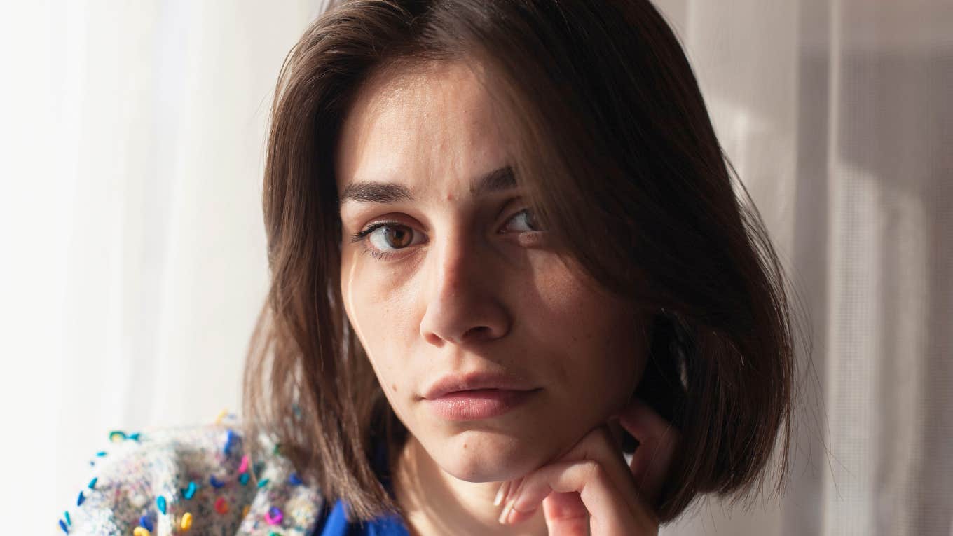 sad serious young woman using coping mechanisms