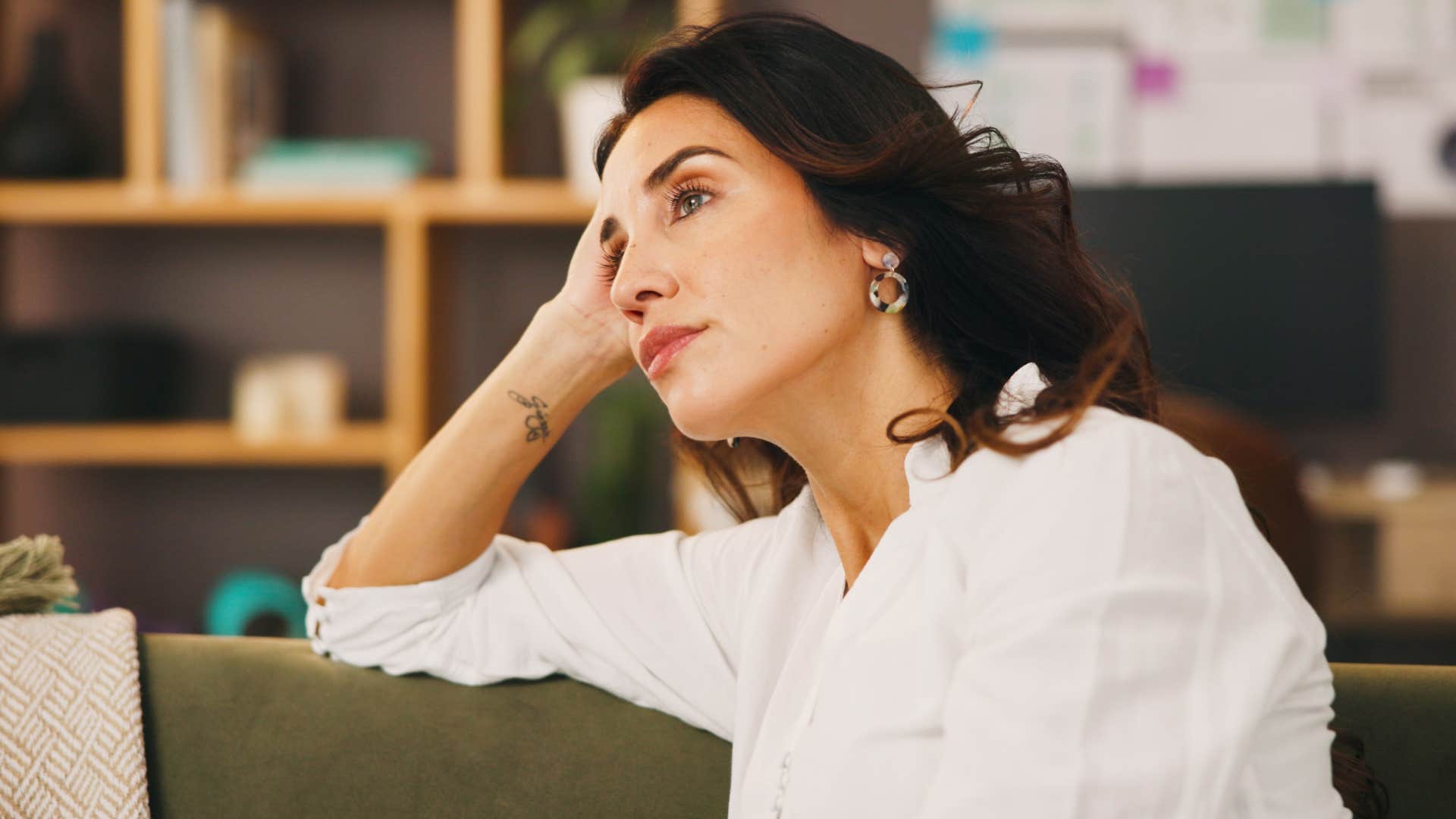 Woman who considers the big picture thinking at home.