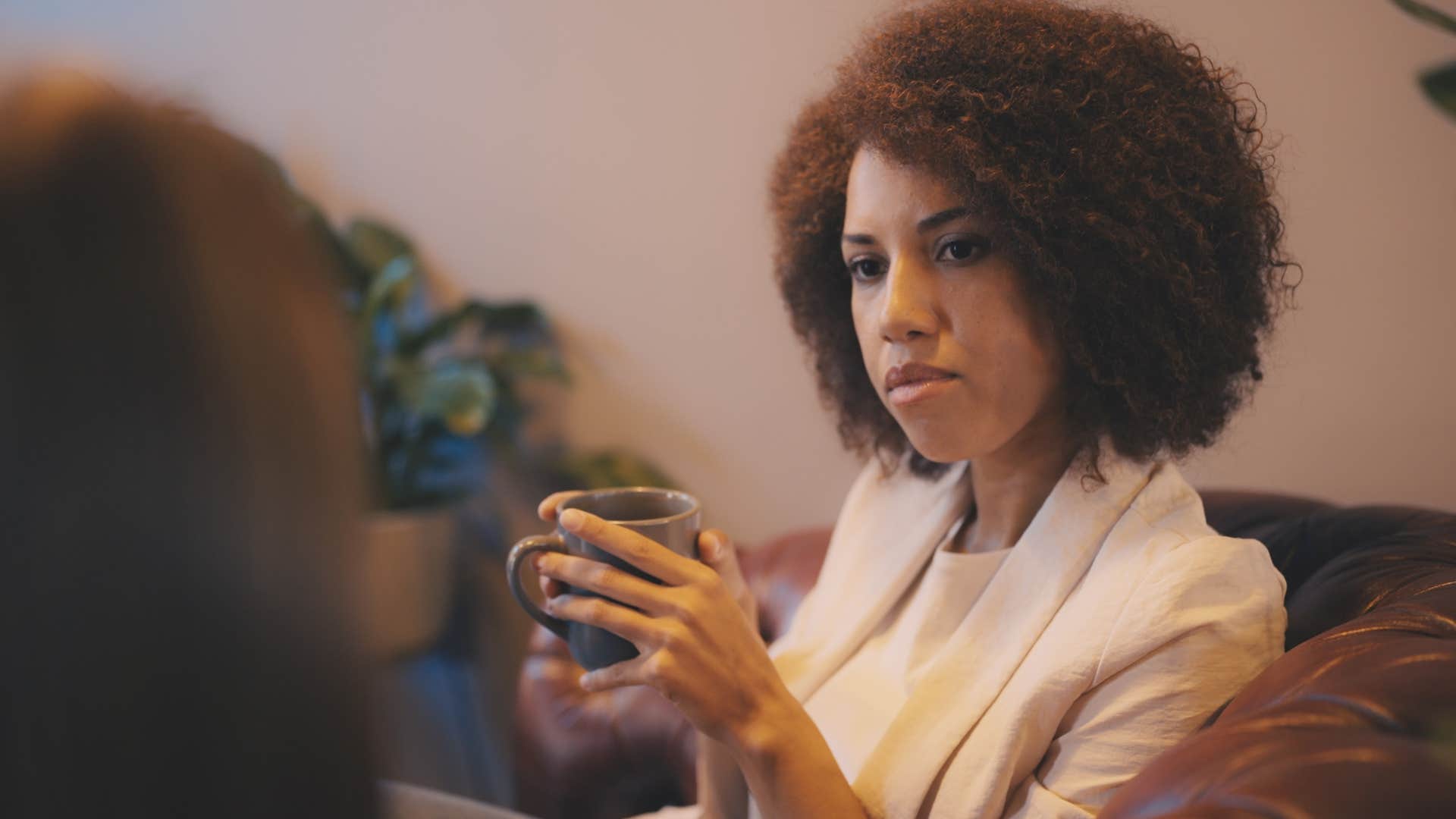 Woman keeping their ego in check on the couch at home.