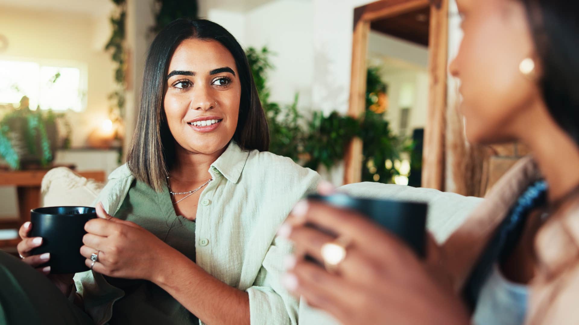 Woman leaning into the "why" with her friend.
