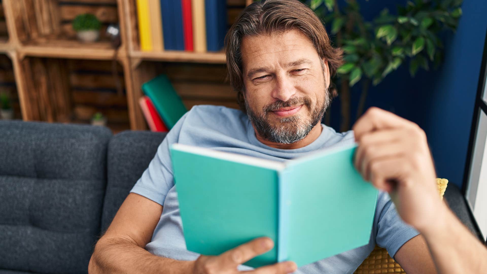 Man learning for fun while reading a book.