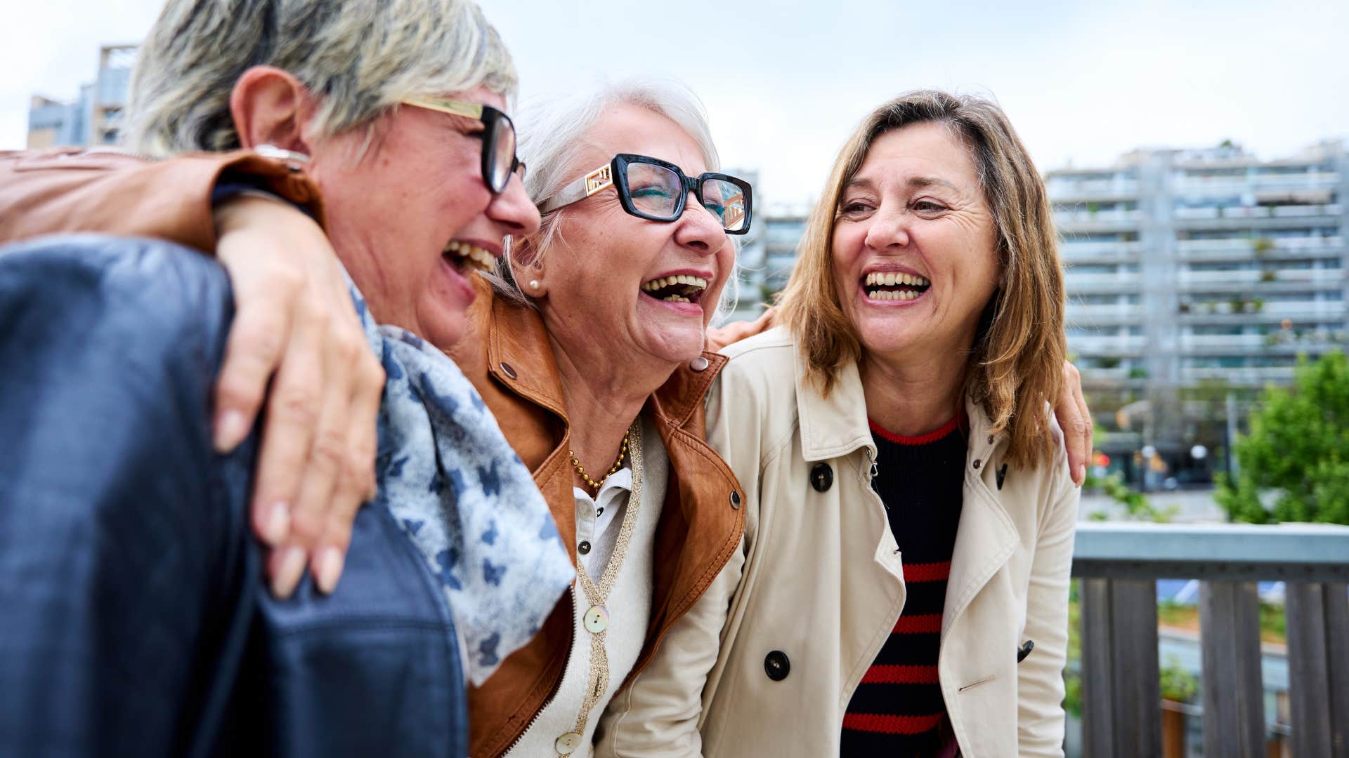 group of women finding meaning in challenges hugging