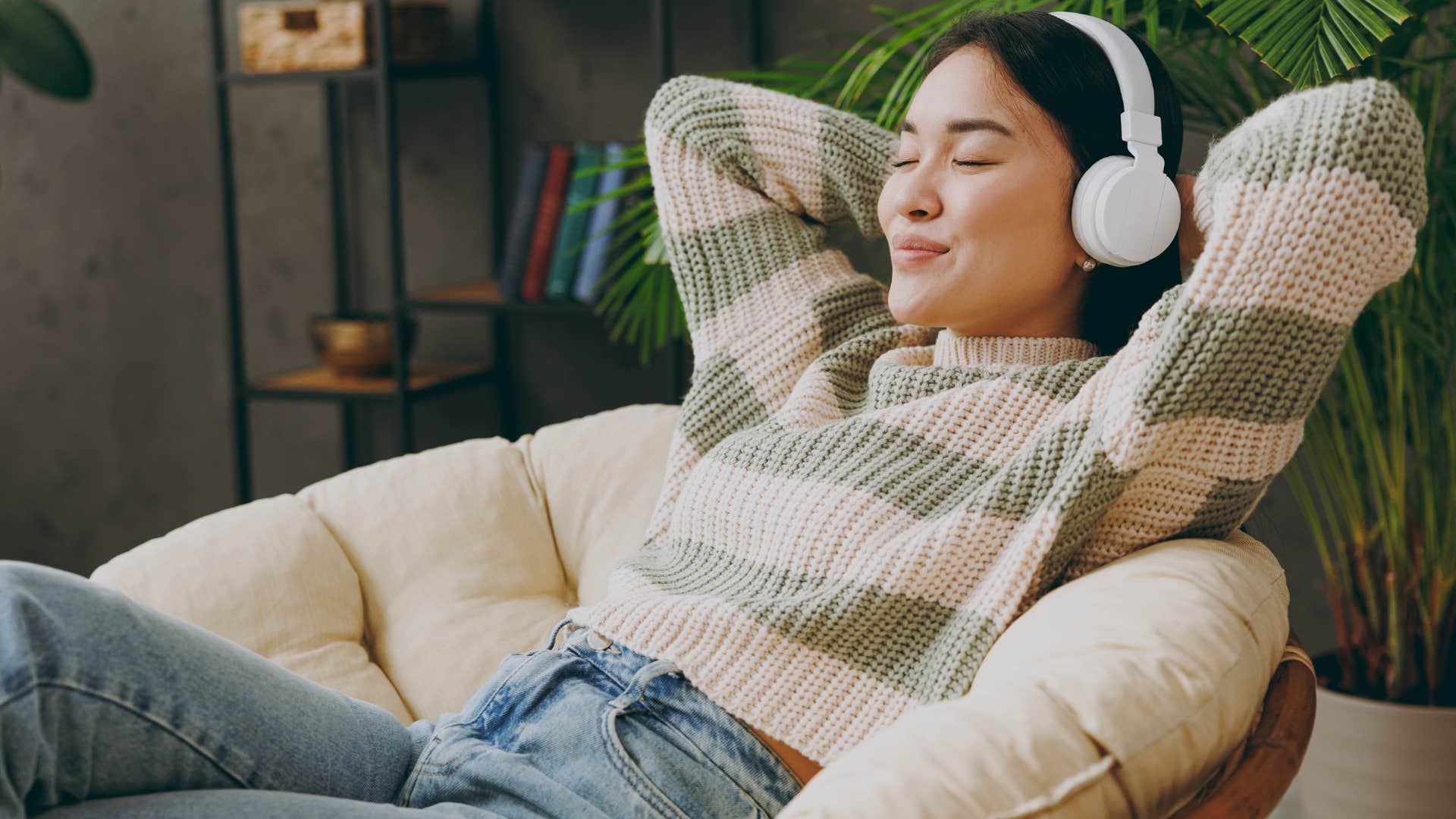 woman relaxing listening to music to regulate her nervous system