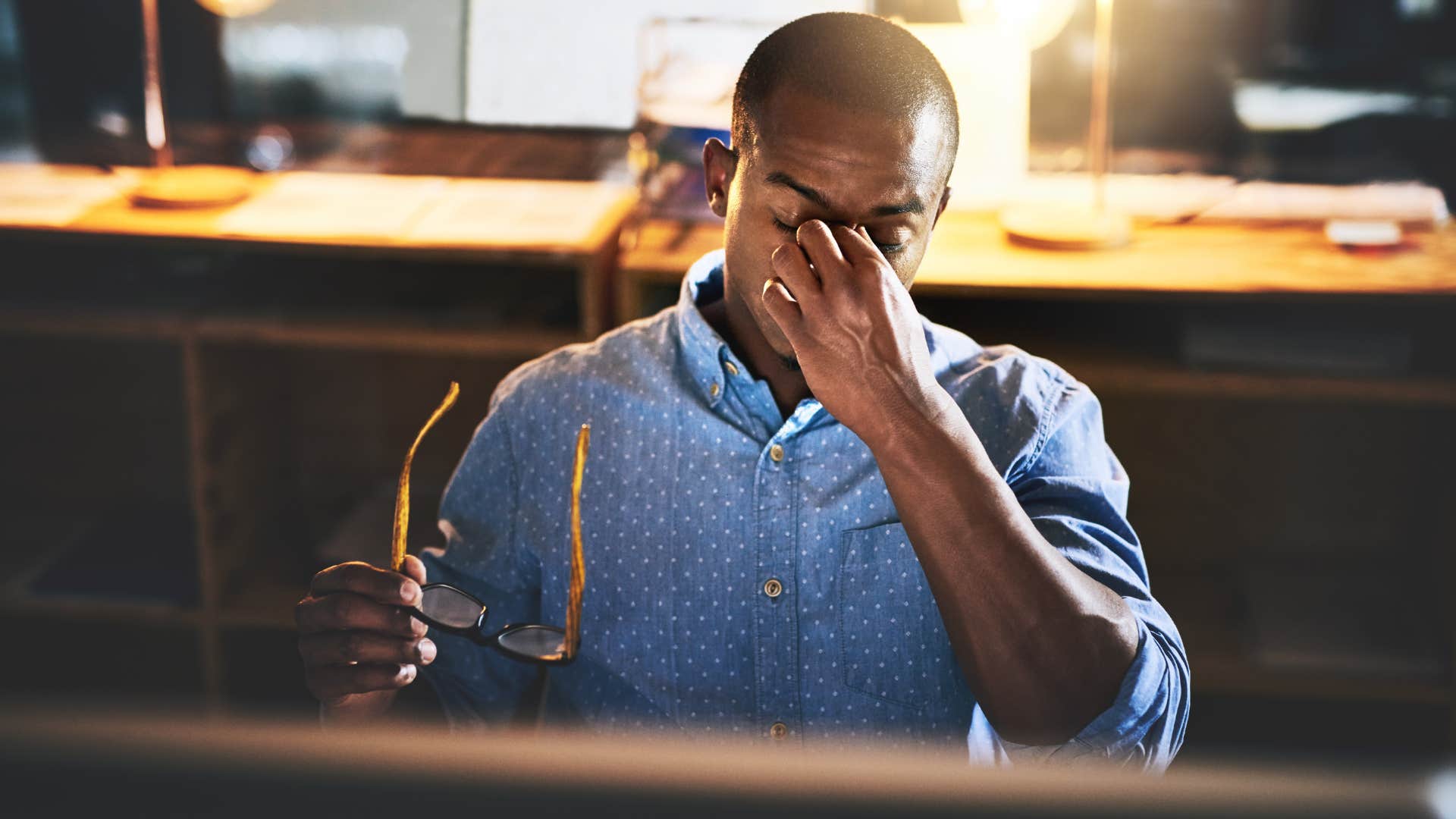 man who's always productive sitting in a dark office