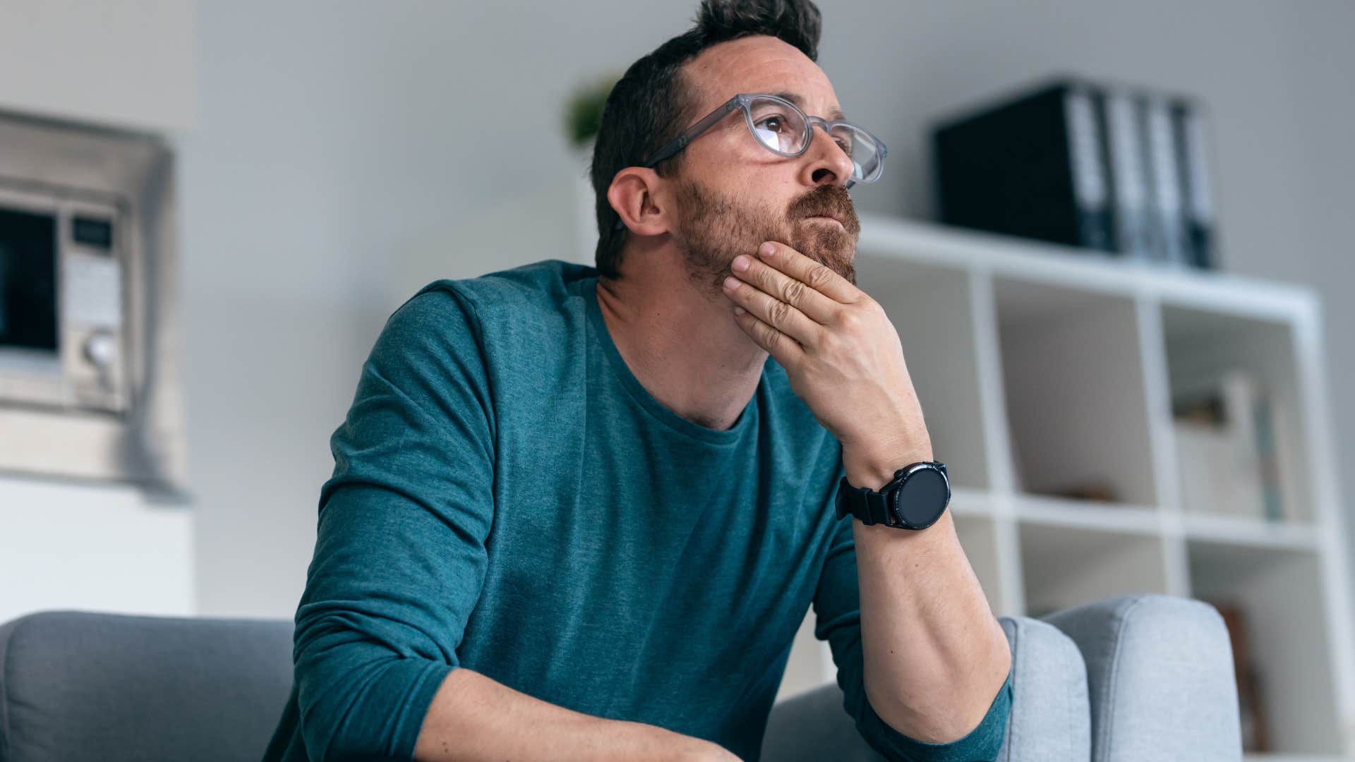 man who feels chronically misunderstood sitting at home alone