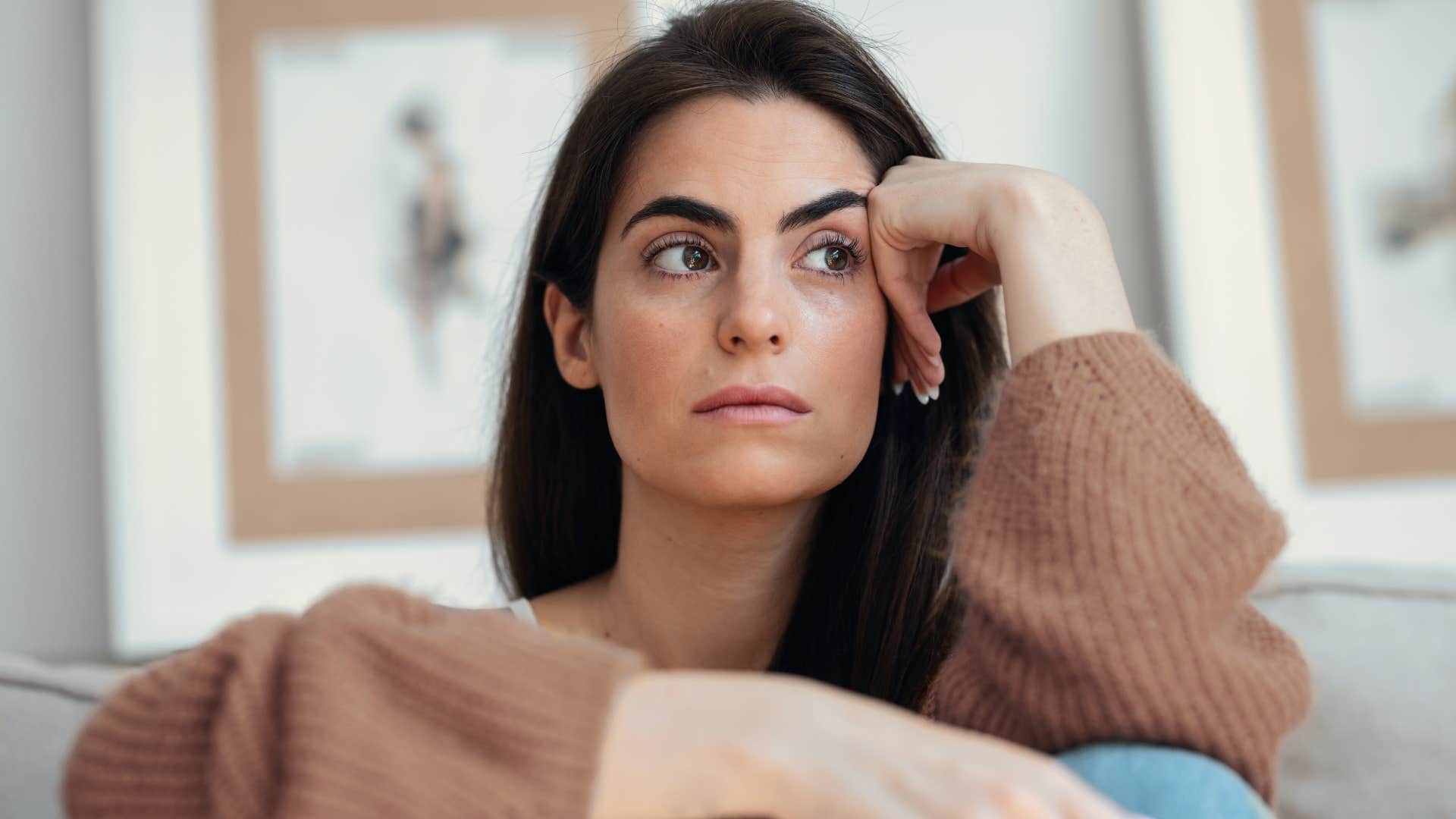 intelligent woman overthinking at home