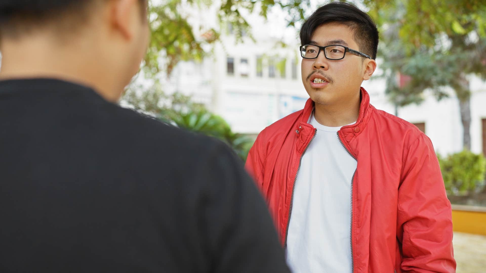 intelligent man struggling with small talk with neighbor