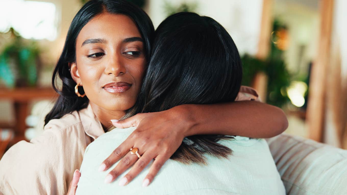 People Who Are Jealous Of Their Friends' Success Usually Have These Reasons woman hugging friend secretly jealous of her