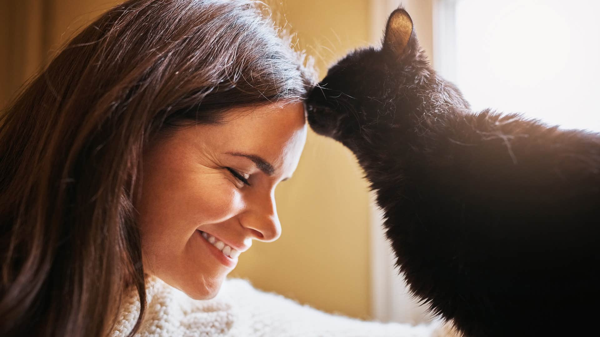 Woman who finds it comforting to have another presence in bed with her cat.
