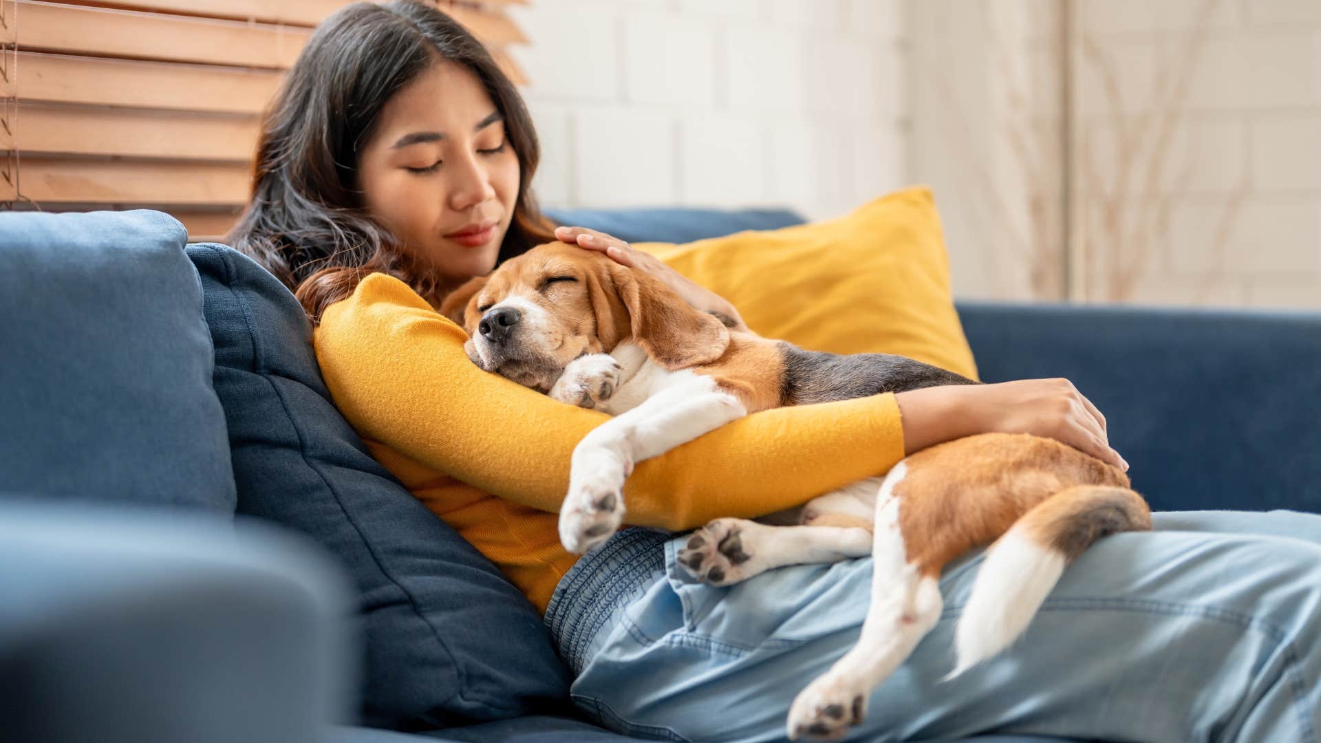 Woman who fears being alone sitting with her dog.
