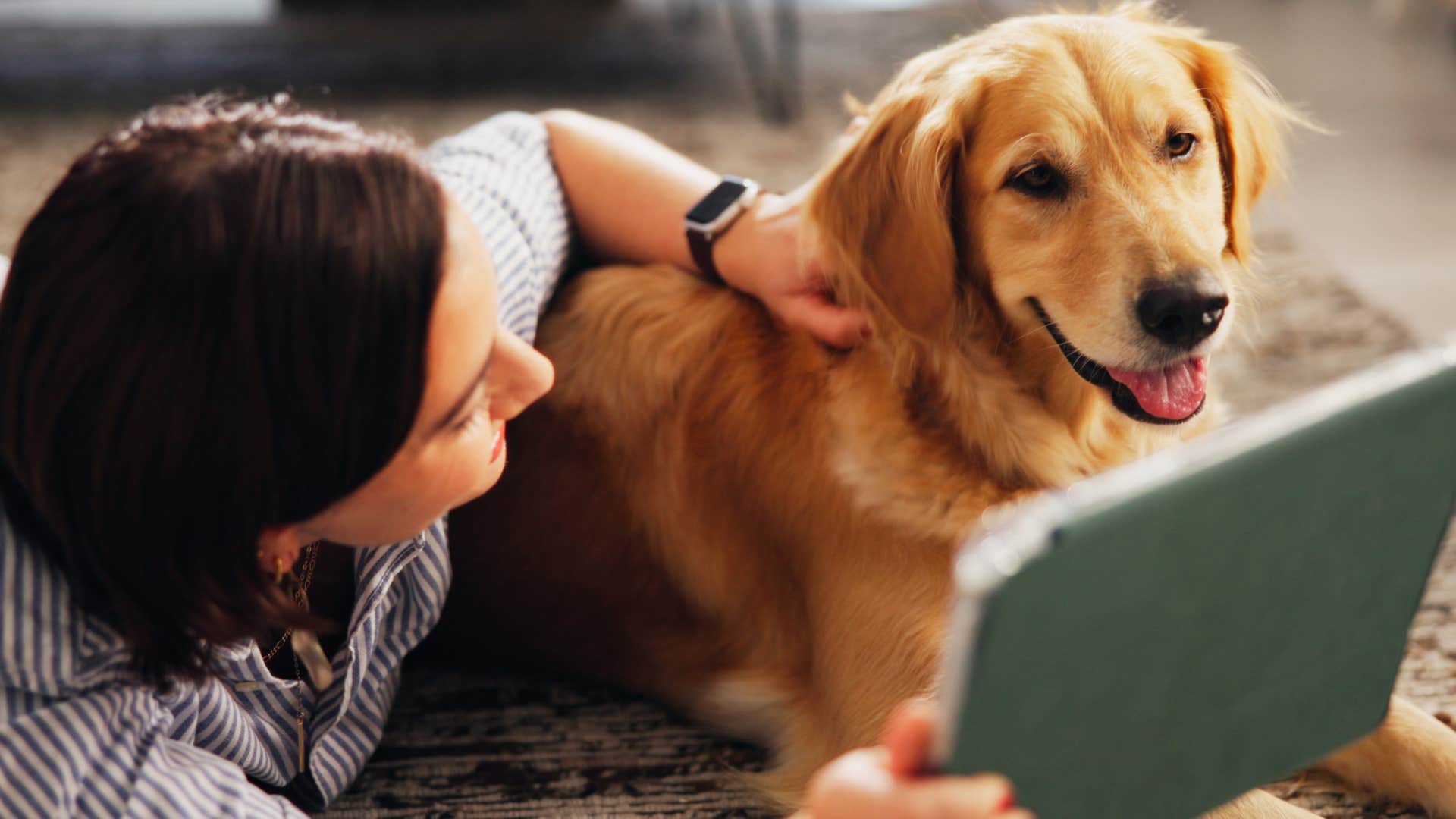 Woman smiling with her dog who lives alone.