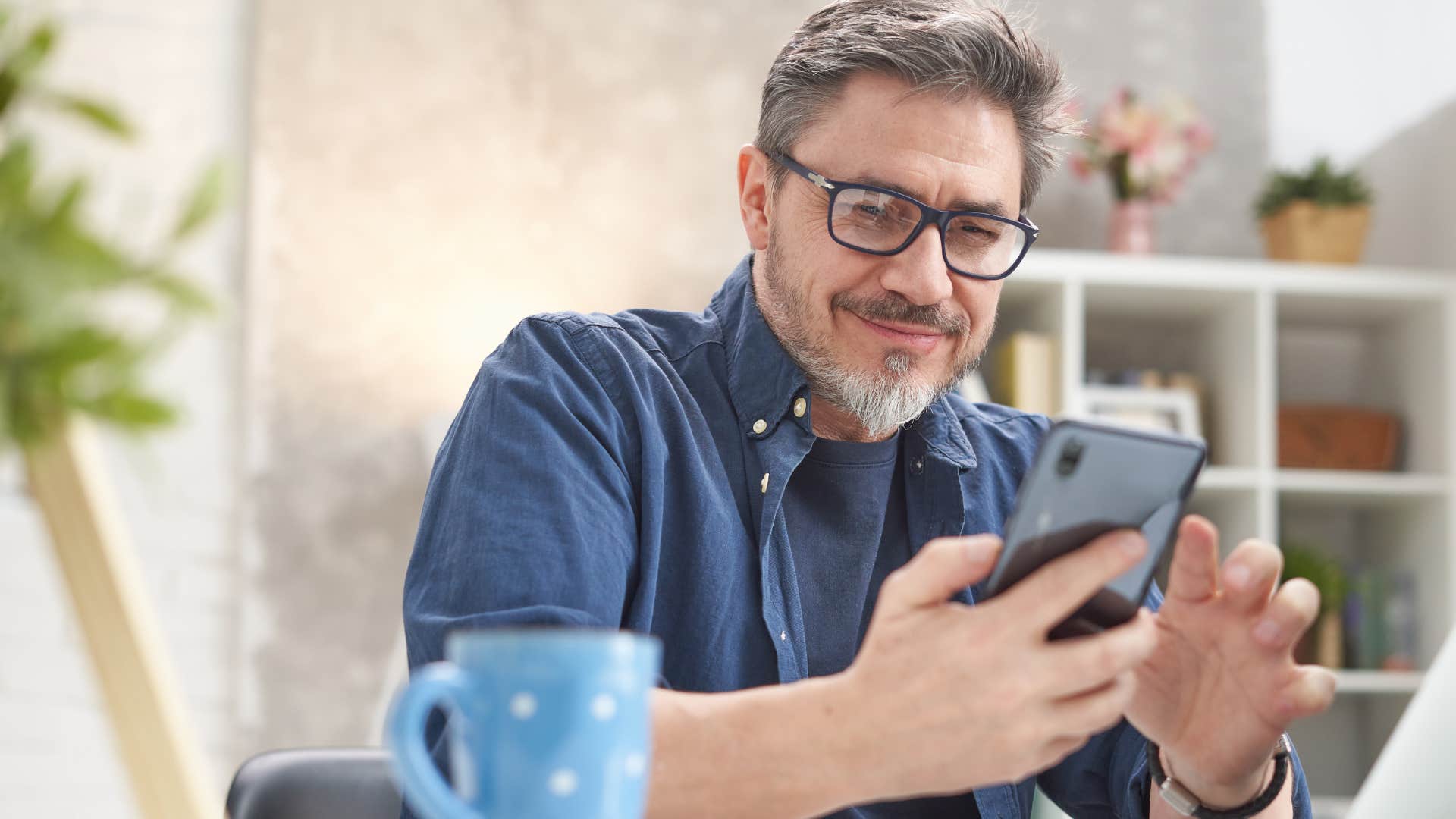 man who's too old for fake friends looking at his phone