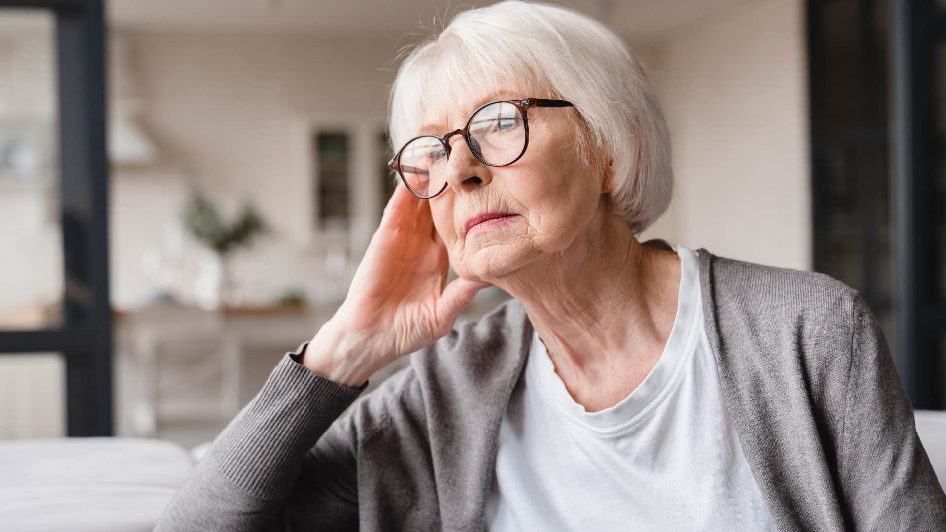 woman who's highly sensitive sitting at home alone
