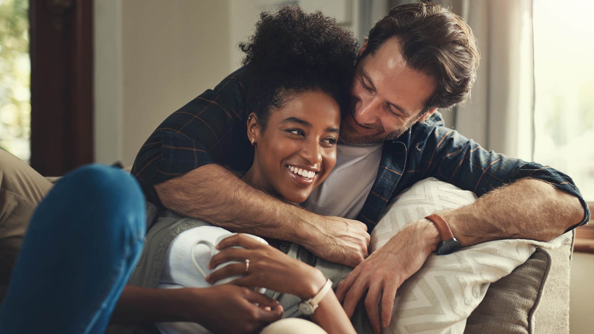 woman who values quality over quantity hugging her partner at home