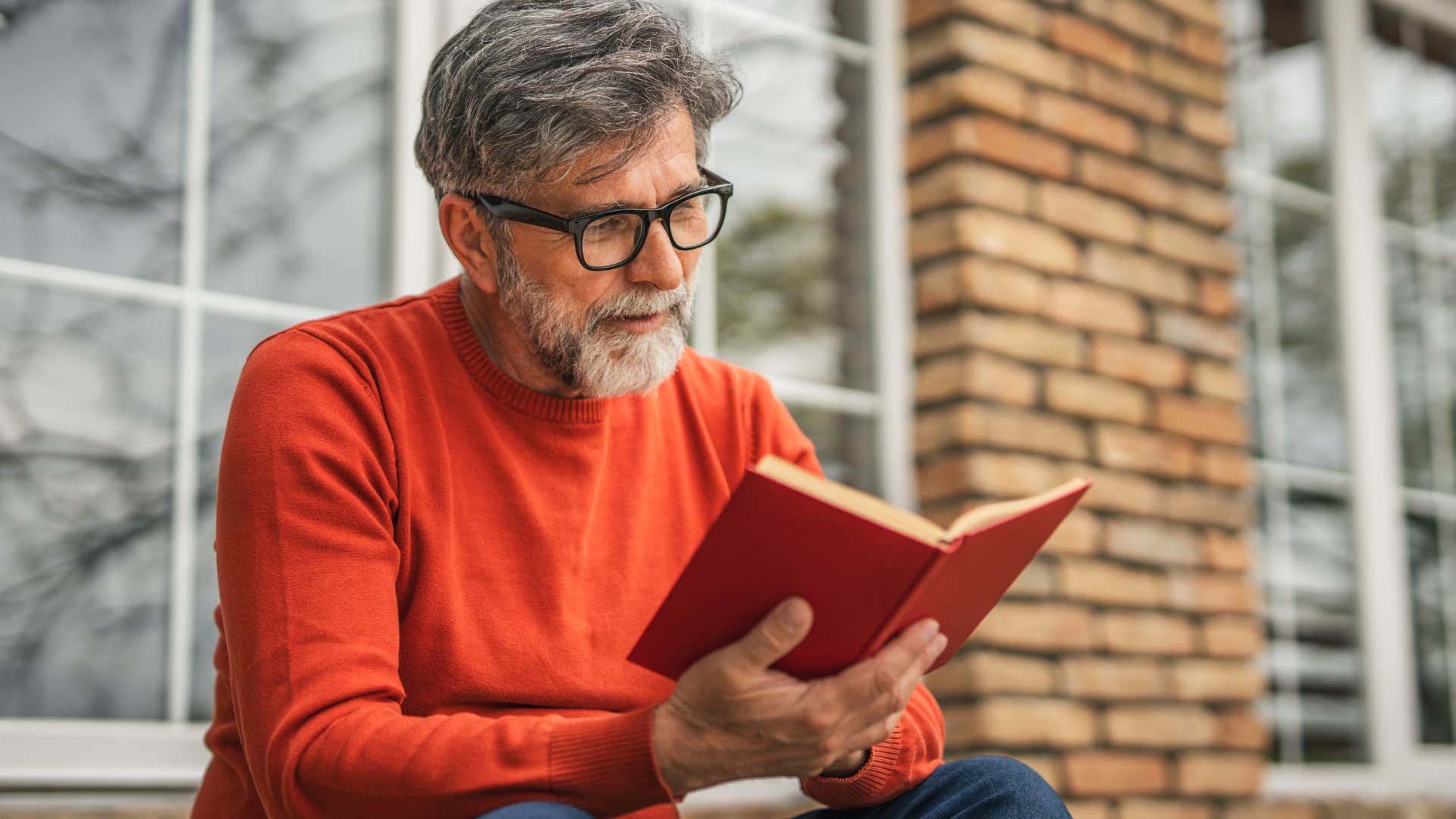 man who's a recovering people-pleaser reading a book