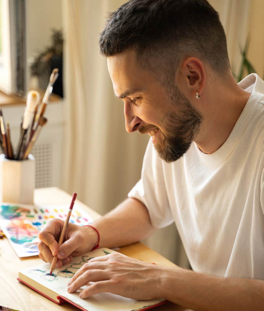Calm person spends time coloring