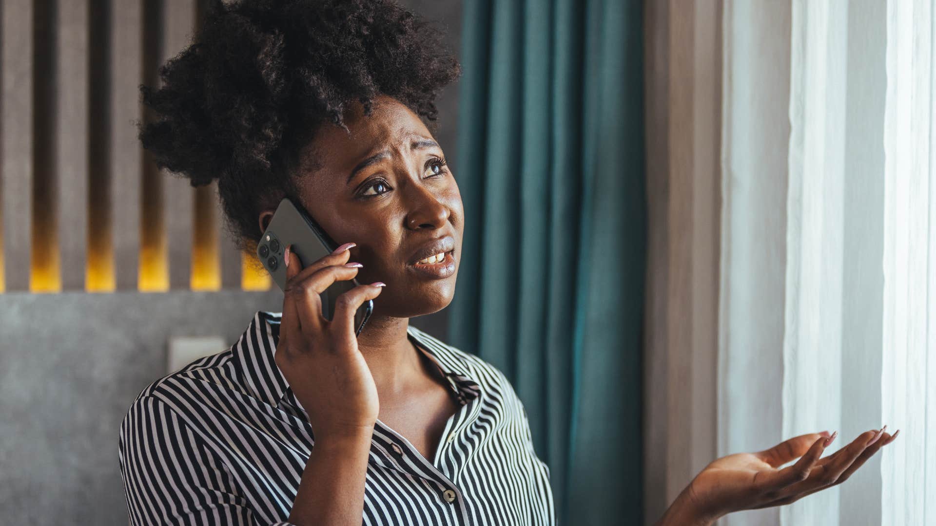 Woman saying "I've had a busy week" on the phone.