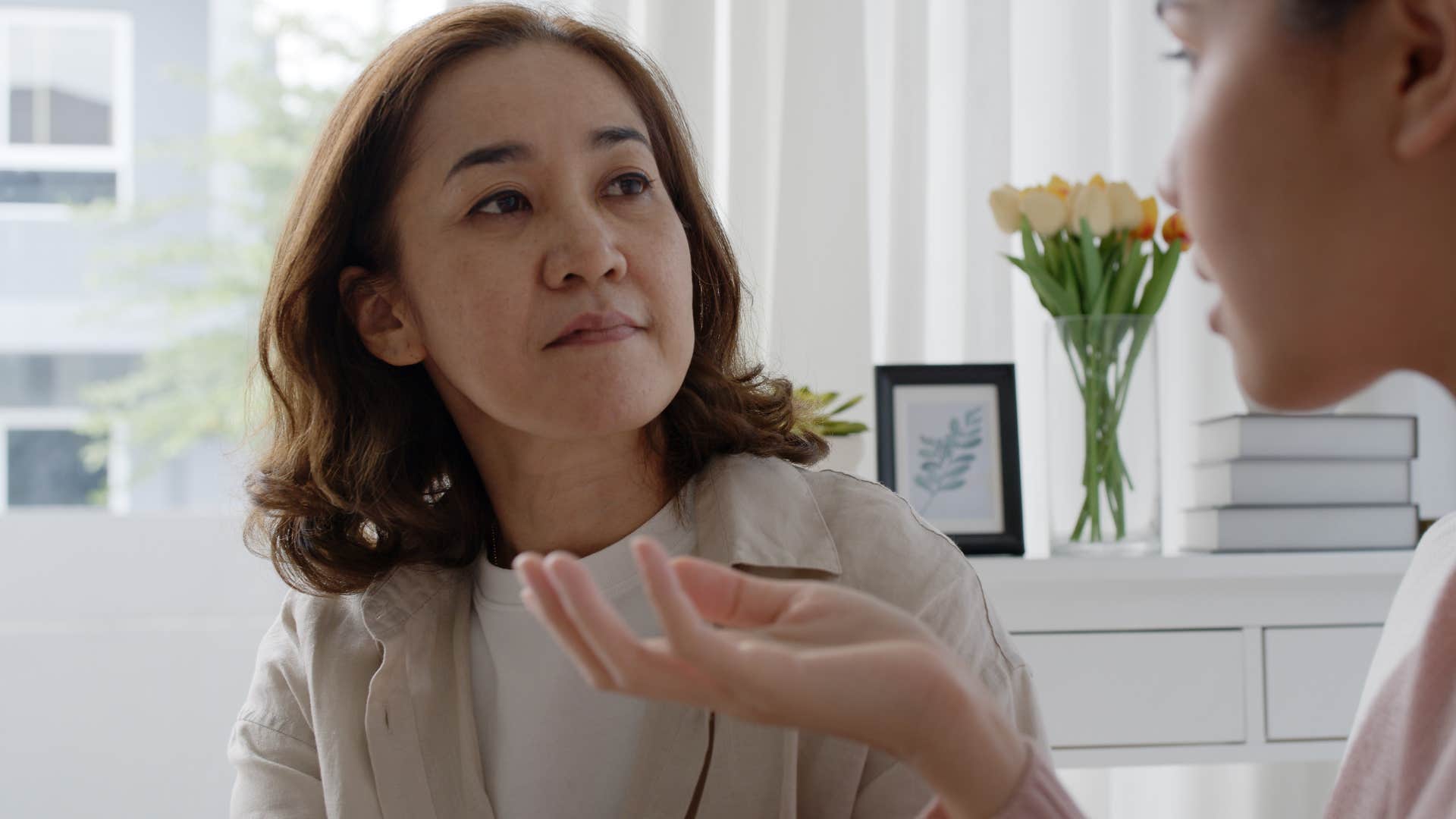 Woman whose nervous system is in survival mode talking to her daughter.