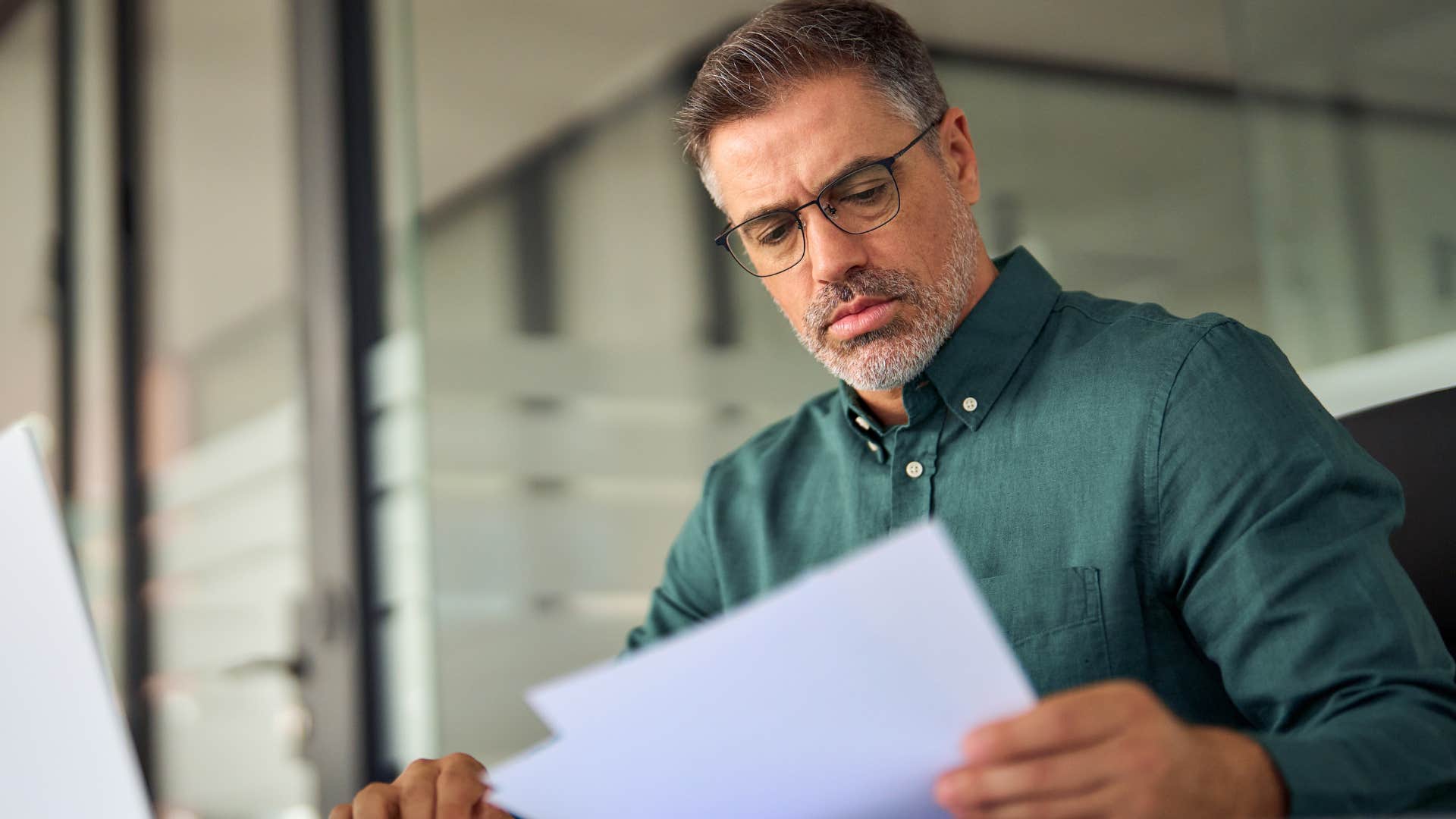 Man who works too much sitting in his office.